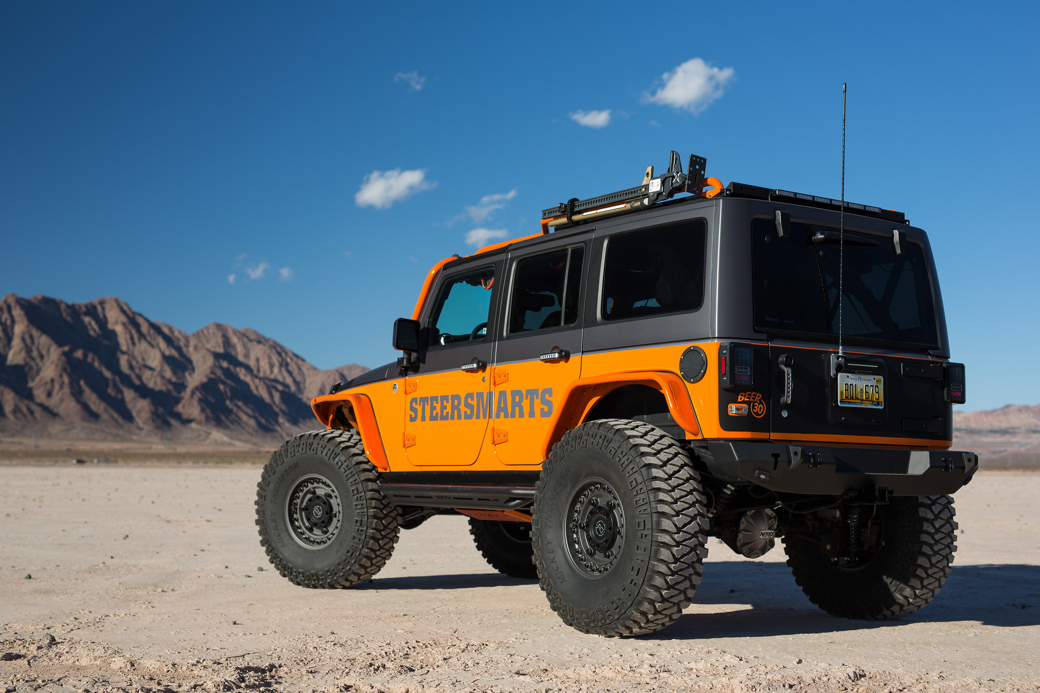 Mickey Thompson Tires on Orange Jeep Wrangler - Photo by Black Rhino
