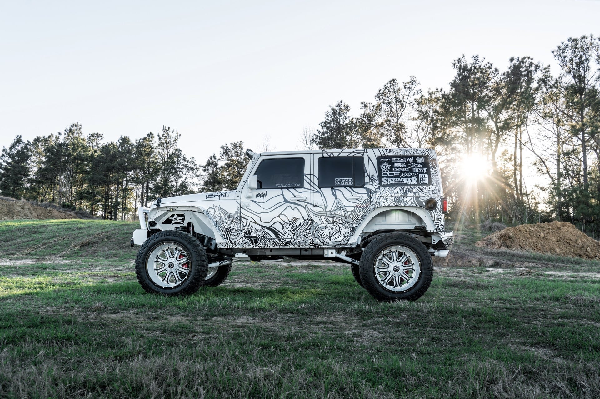 Skyjacker Lift Kit on Custom White Jeep Wrangler - Photo by TIS Wheels