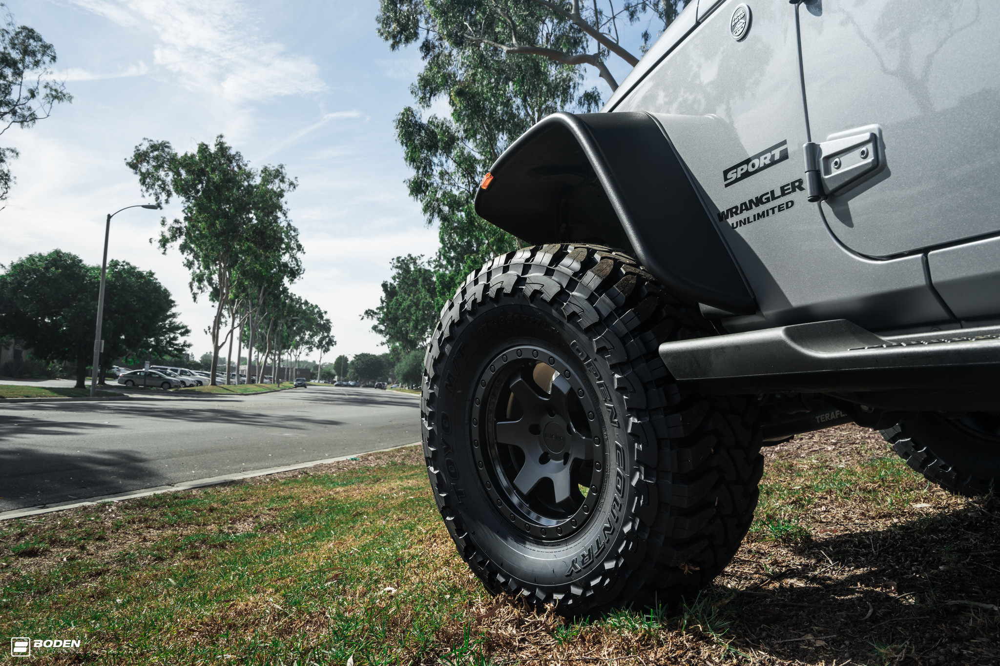 Aftermarket Running Boards on Gray Jeep Wrangler - Photo by Boden Autohaus