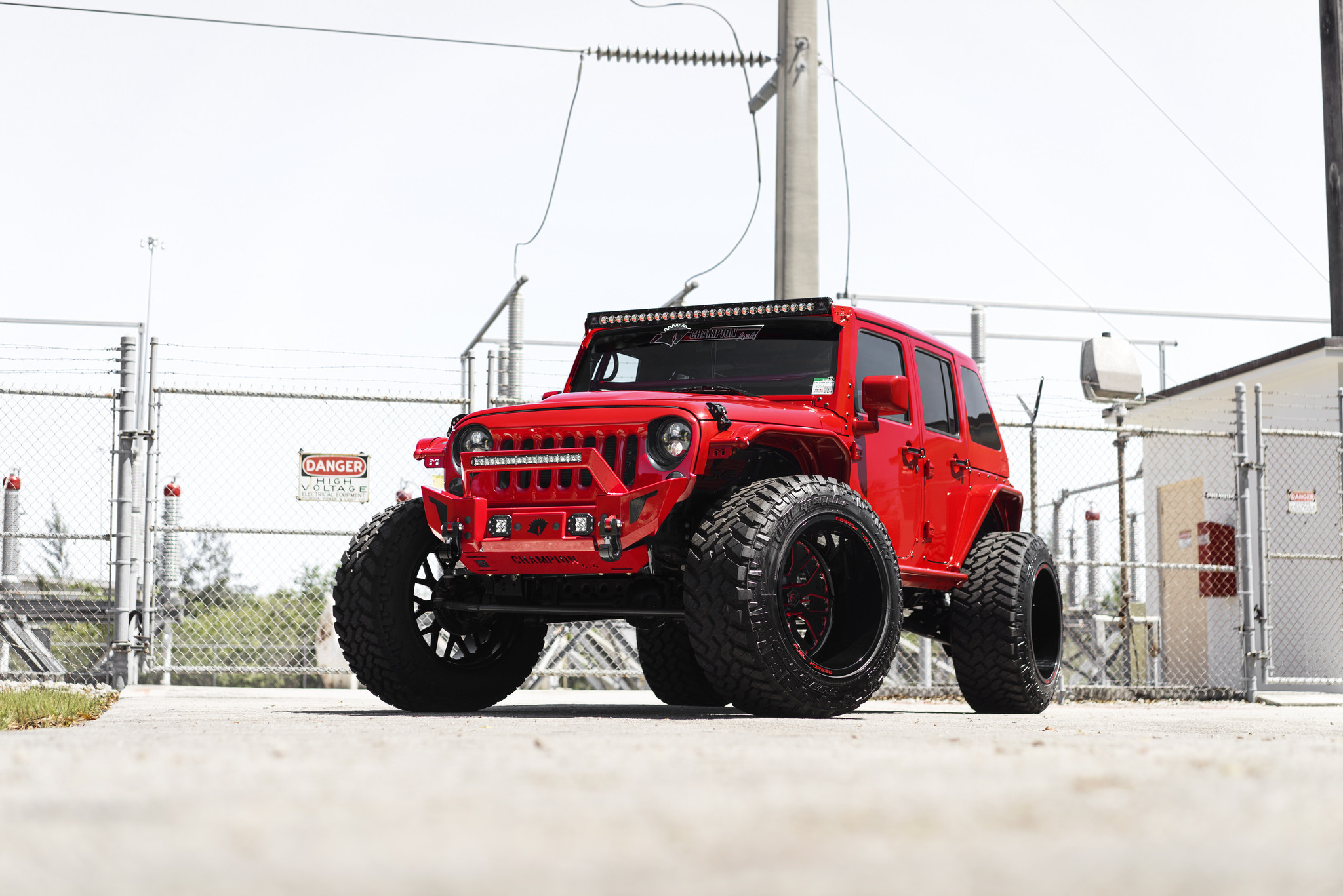 Red Jeep Wrnagler on Huge Off-road Wheels - Photo by Fuel Off-Road