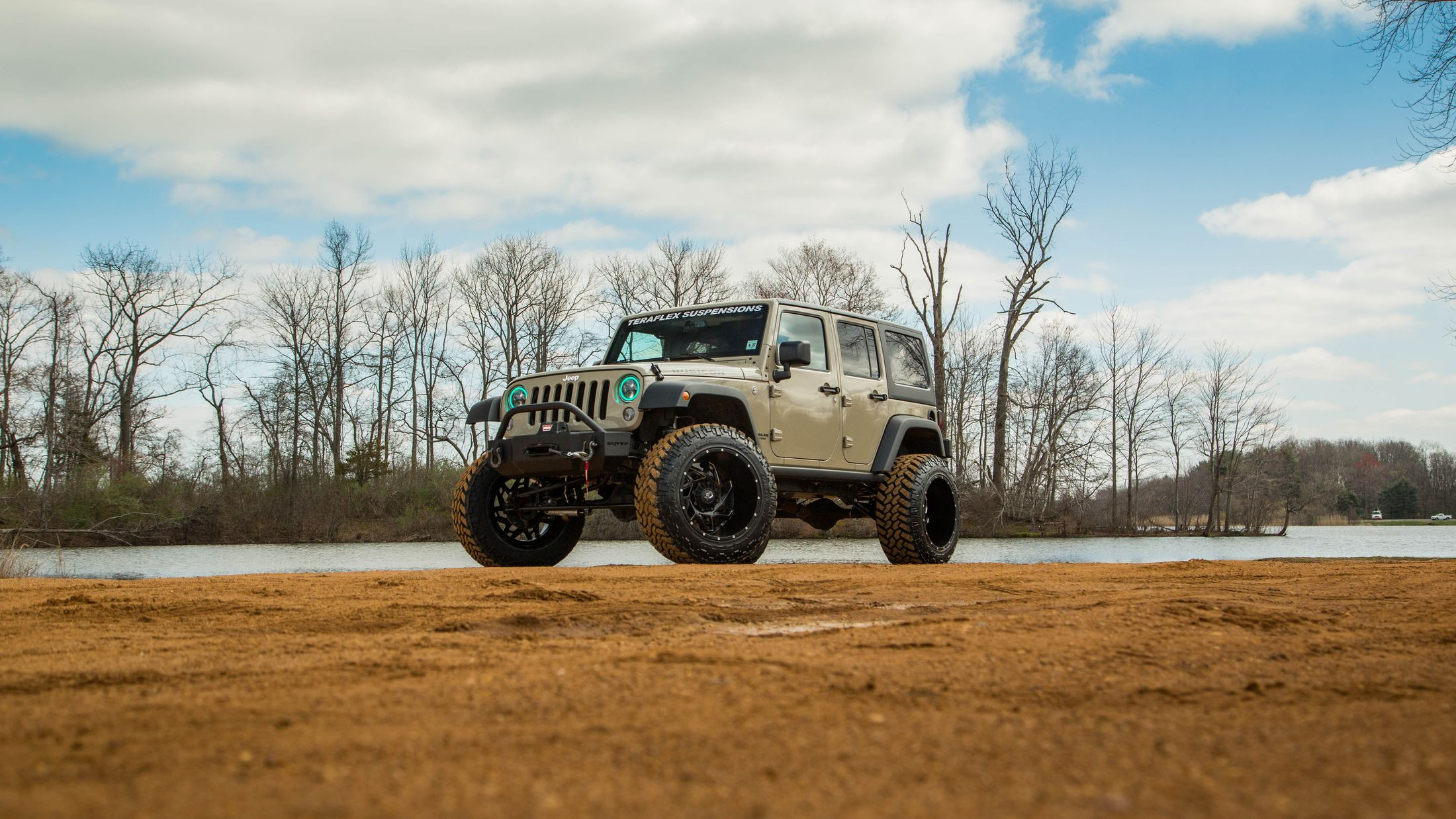 Aftermarket Fender Flares on Beige Lifted Jeep Wrangler - Photo by CARiD