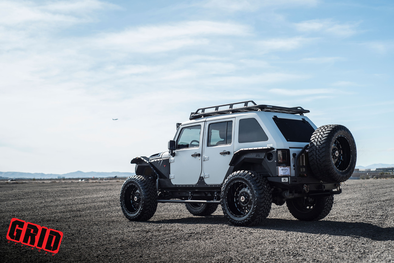 Jeep Wrangler JK Unlimited With White Fastback Style Hardtop - Photo by Grid Off-road
