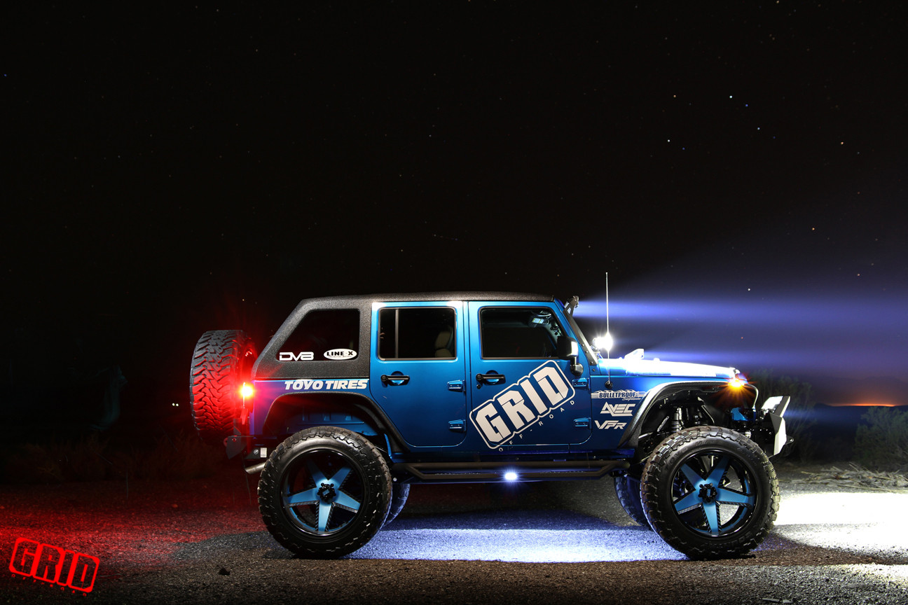 Blue Jeep Wrangler With Readylift and Off-road Wheels - Photo by Grid Off-road