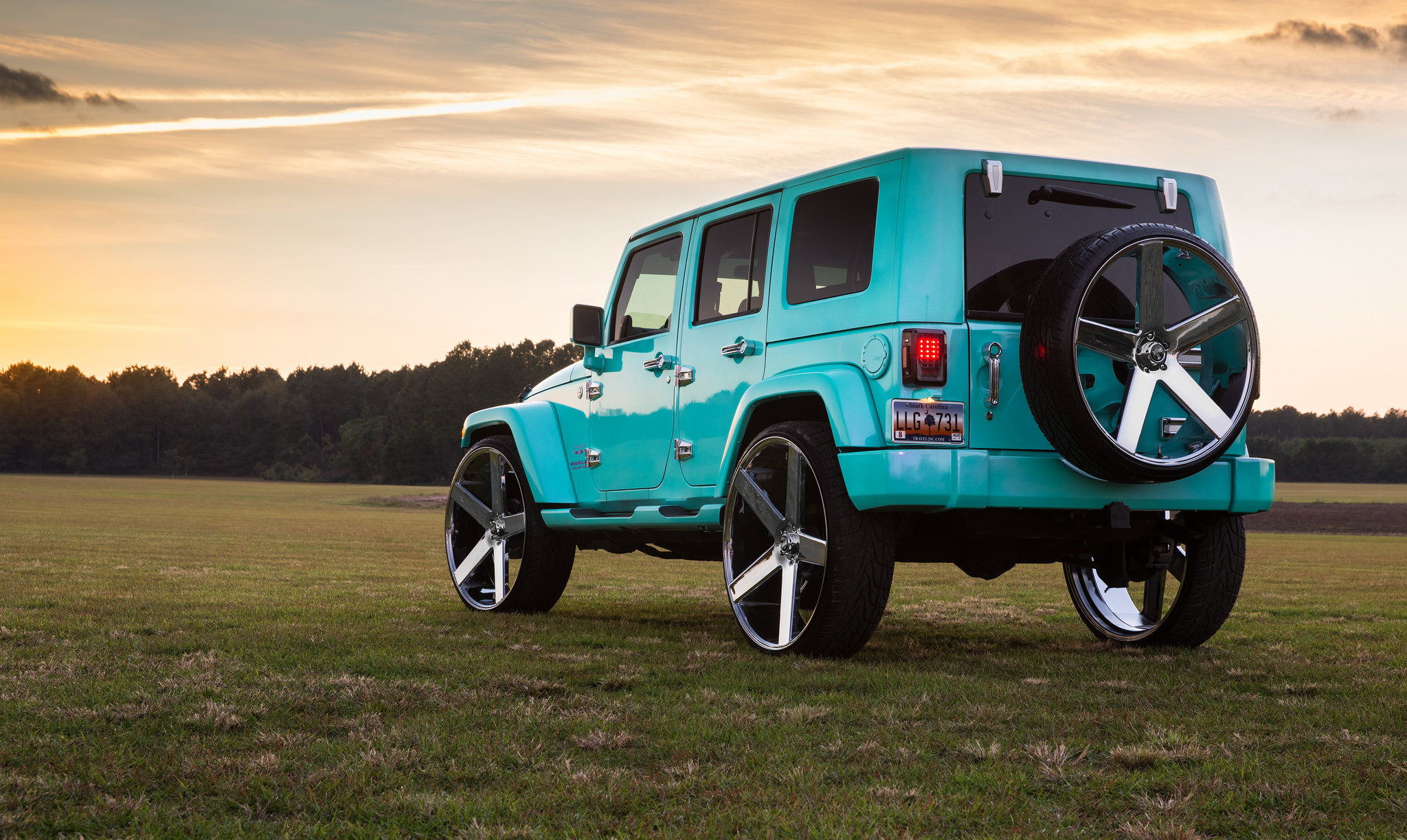 Spare Tire Carrier on Jade Green Jeep Wrangler - Photo by DUB
