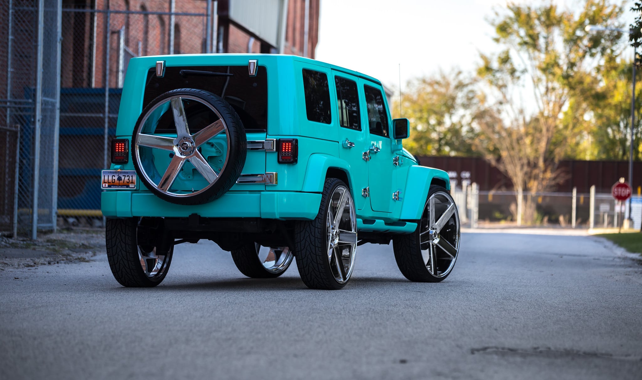 Jade Green Jeep Wrangler Unlimited with Spare Tire Carrier - Photo by DUB
