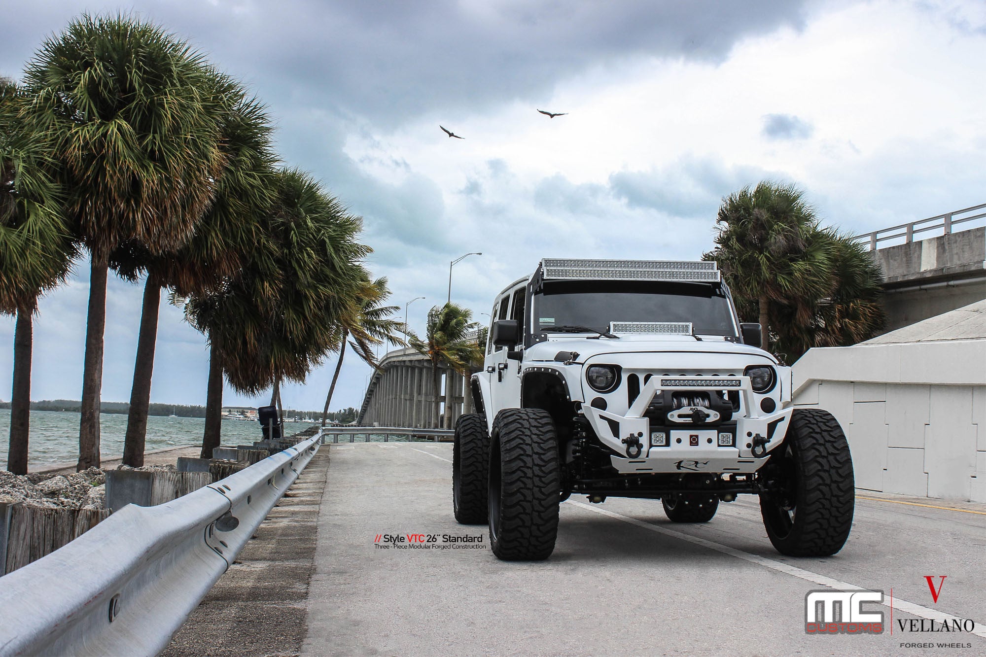 White Jeep Wrangler with Custom Off-road Winch Front Bumper - Photo by Vellano