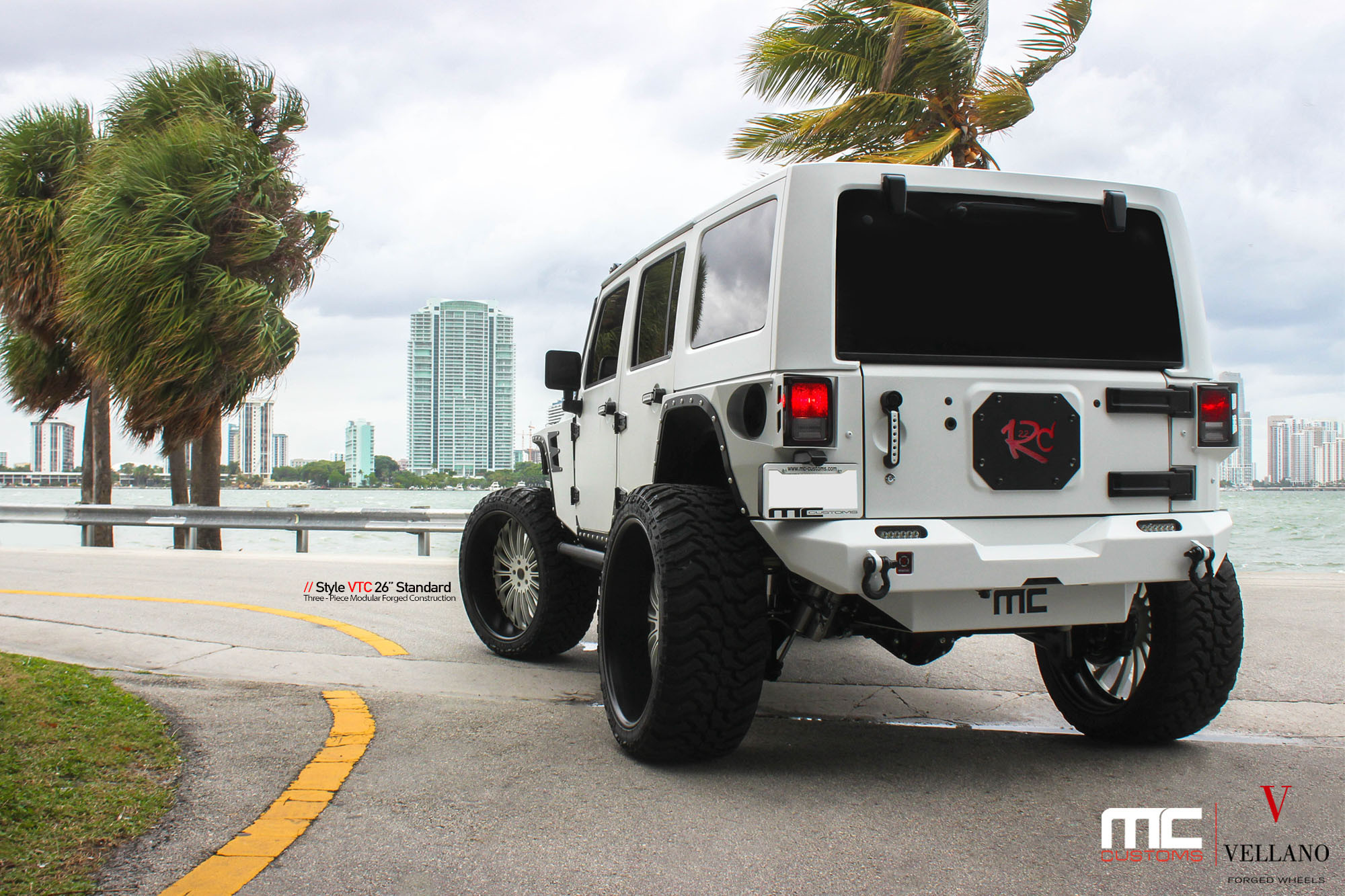 White Jeep Wrangler with Custom Off-road Rear Bumper - Photo by Vellano