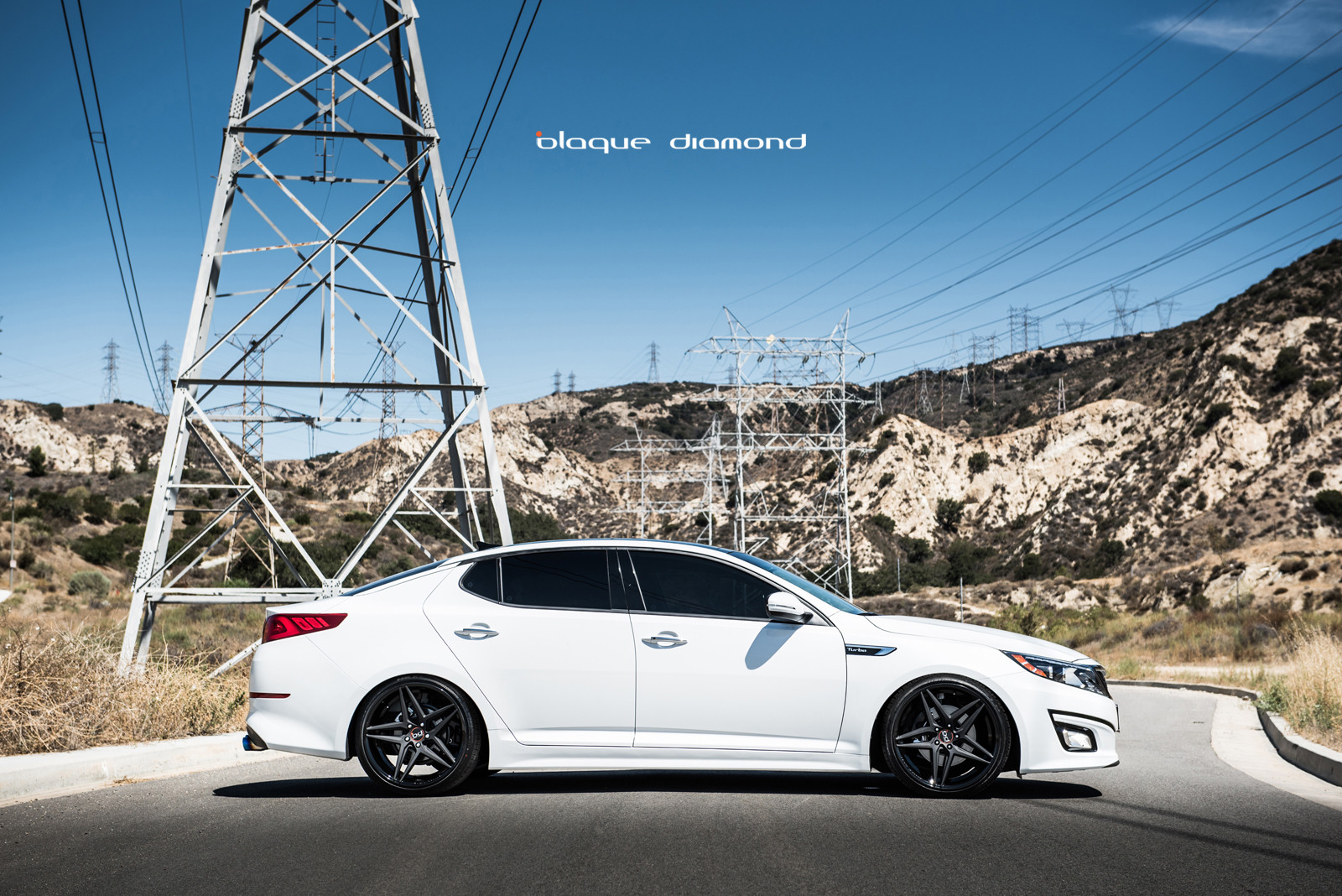 Custom White Kia Optima Side Skirts - Photo by Blaque Diamond