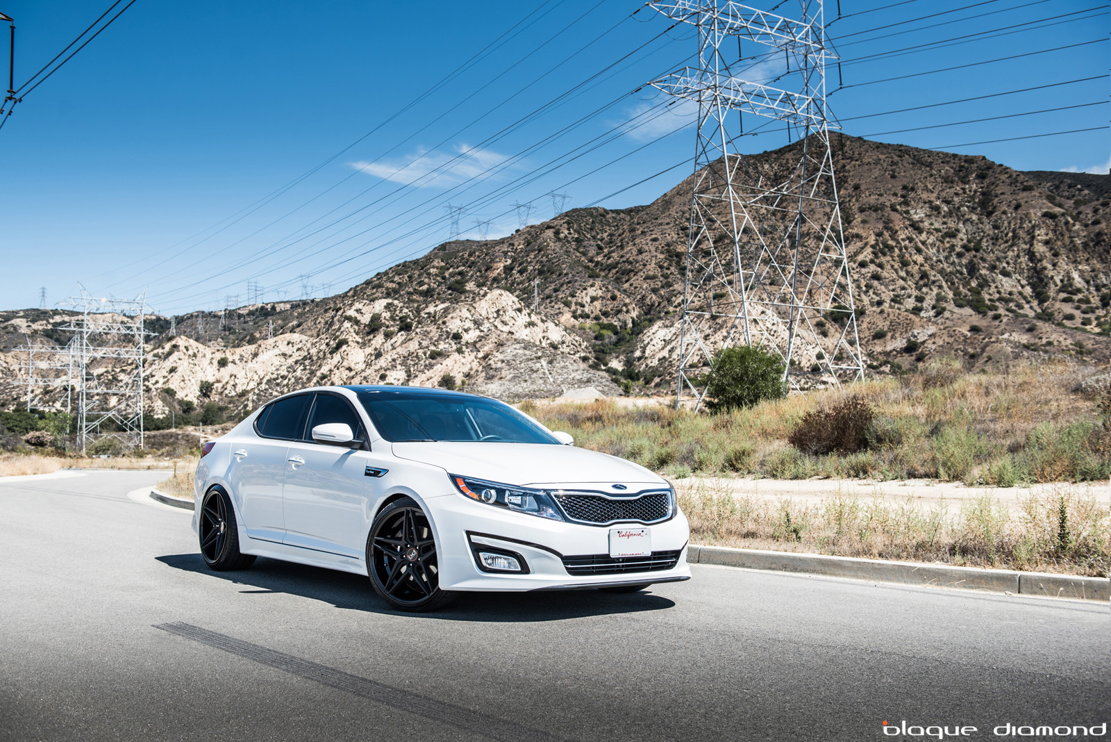 Matte Black Blaque Diamond Rims on White Kia Optima - Photo by Blaque Diamond