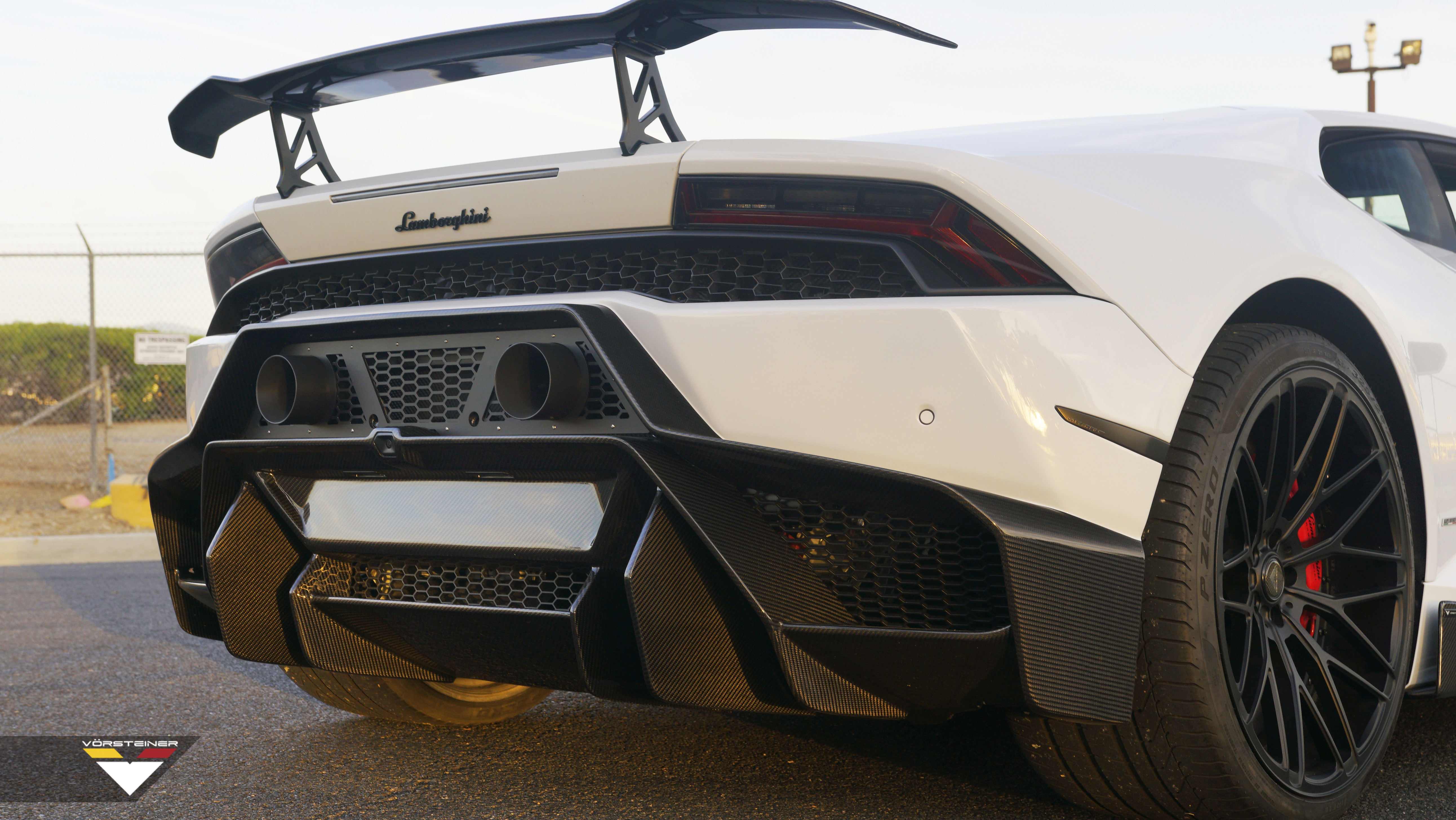 Carbon Fiber Rear Diffuser on White Lamborghini Huracan - Photo by Vorstiner