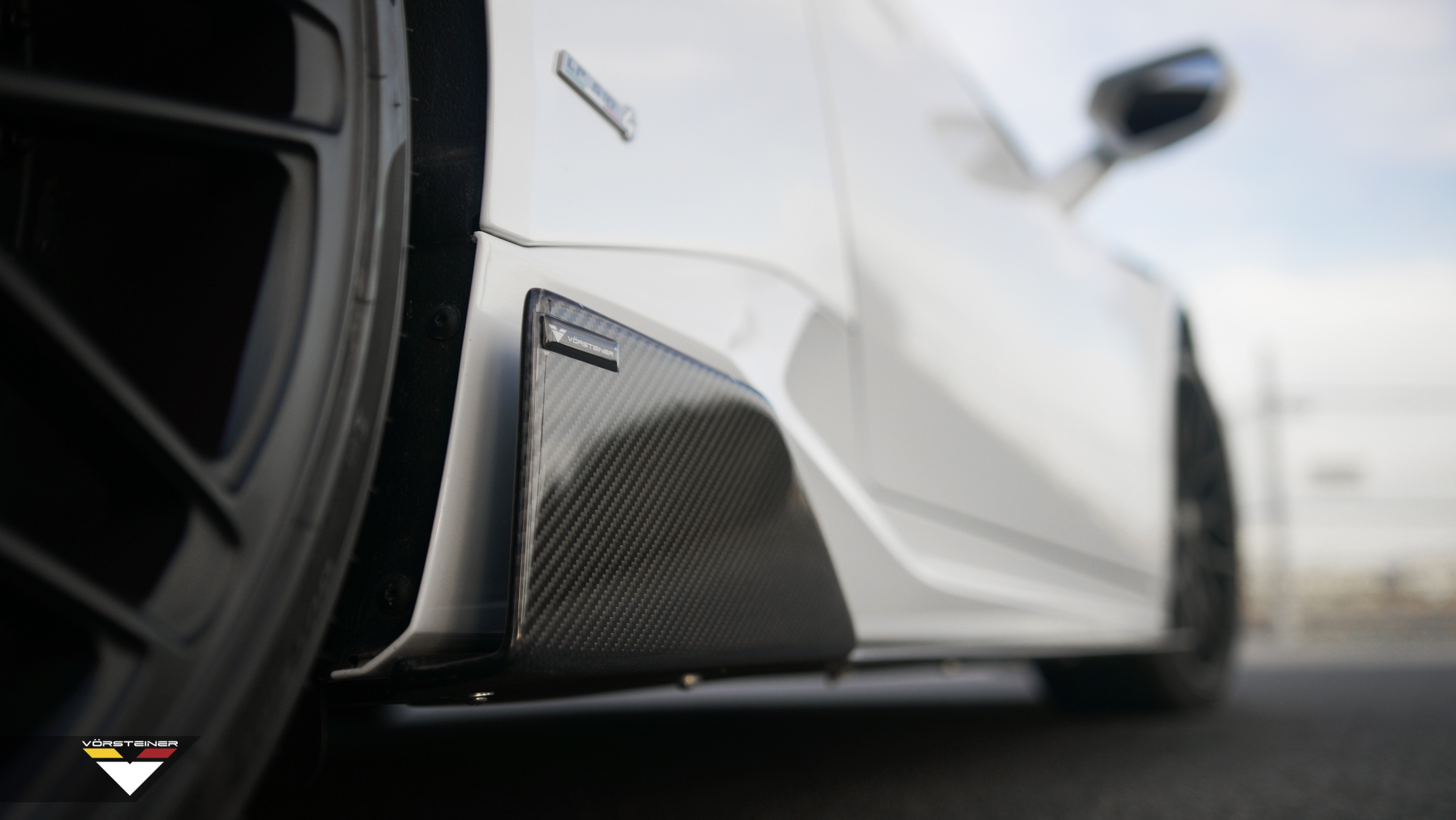 Carbon Fiber Side Skirts on White Lamborghini Huracan - Photo by Vorstiner