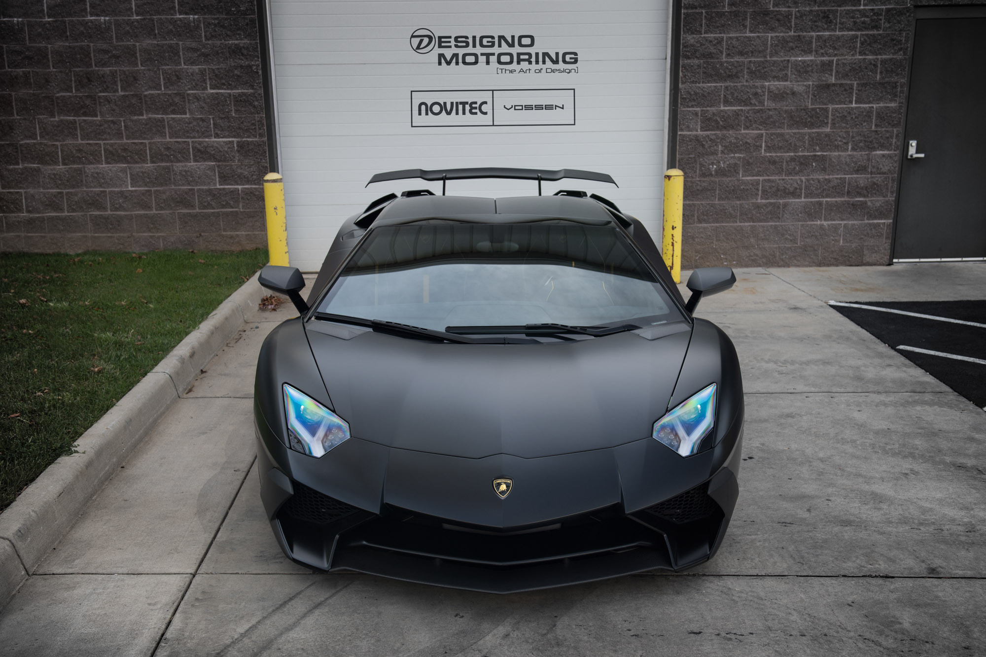 Custom Front Bumper on Black Lamborghini Huracan - Photo by Vossen