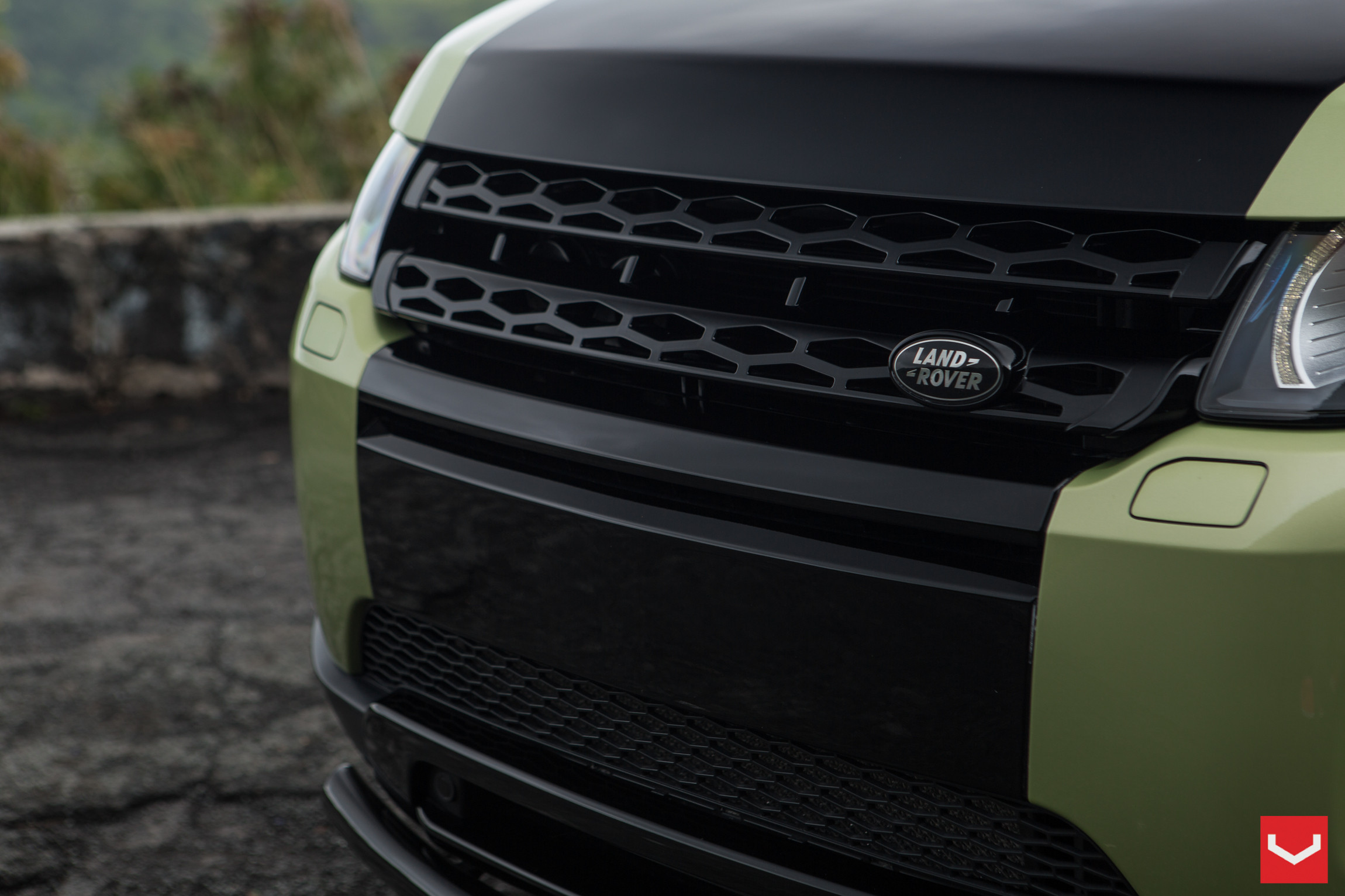 Green Land Rover Range Rover Evoque with Custom Black Grille - Photo by Vossen