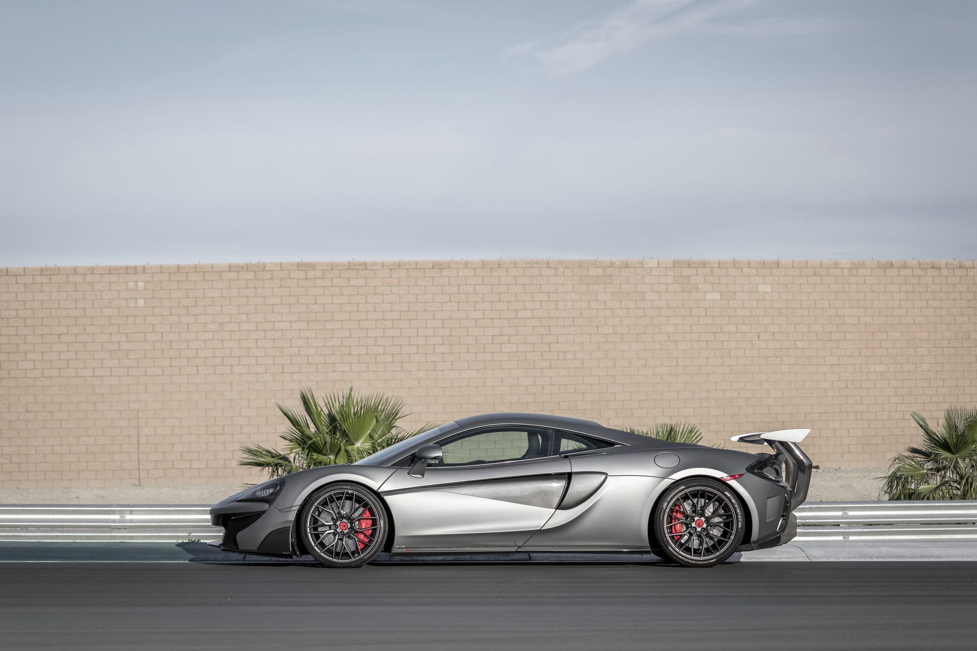 Aftermarket Side Skirts on Gray McLaren 570S - Photo by Vorstiner