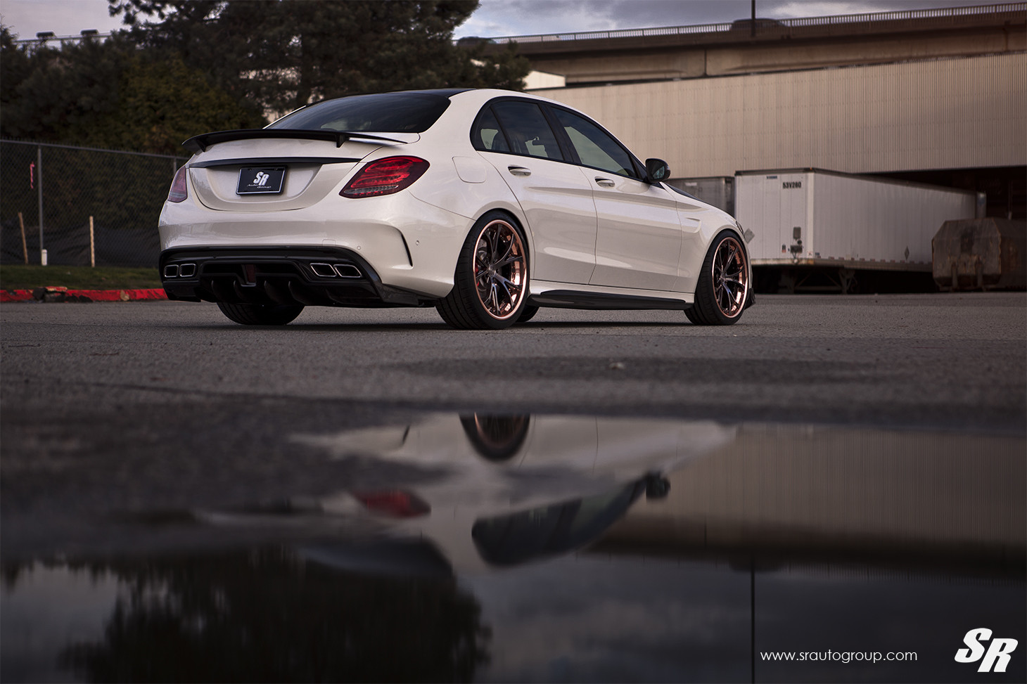 White Mercedes C Class with Aftermarket Rear Spoiler - Photo by SR Auto Group
