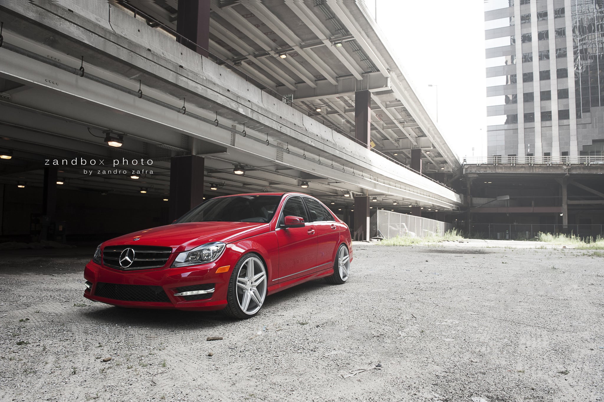 Red Mercedes C Class with Aftermarket Headlights  - Photo by zandbox