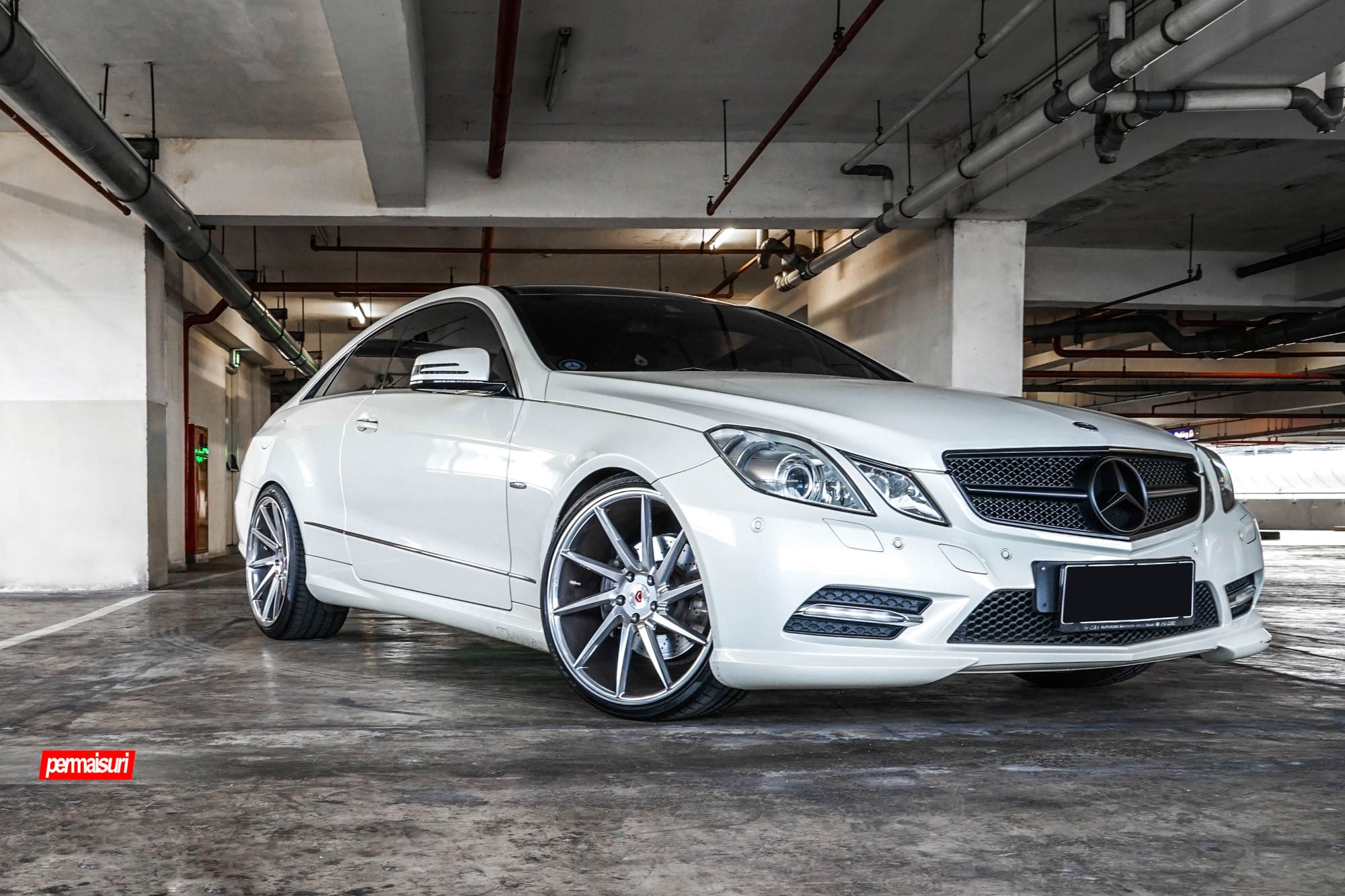 Custom White Mercedes E Class with Blacked Out Grille - Photo by Vossen