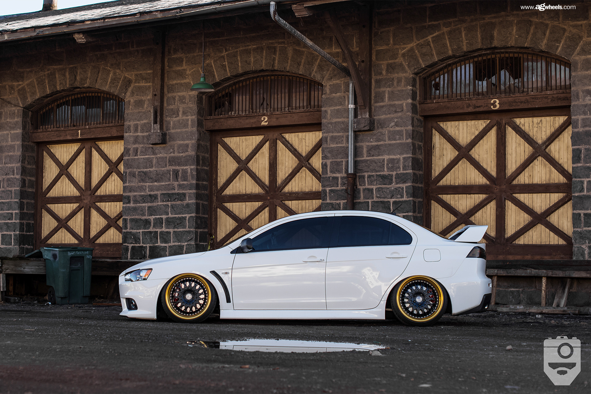 Large Wing Spoiler on White Mitsubishi Evolution - Photo by Avant Garde Wheels