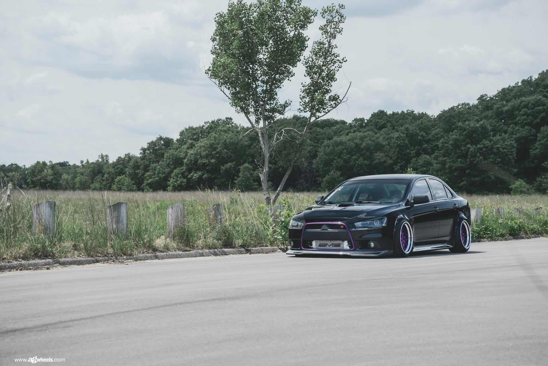 Black Stanced Mitsubishi Evolution with Custom Body Kit - Photo by Avant Garde Wheels