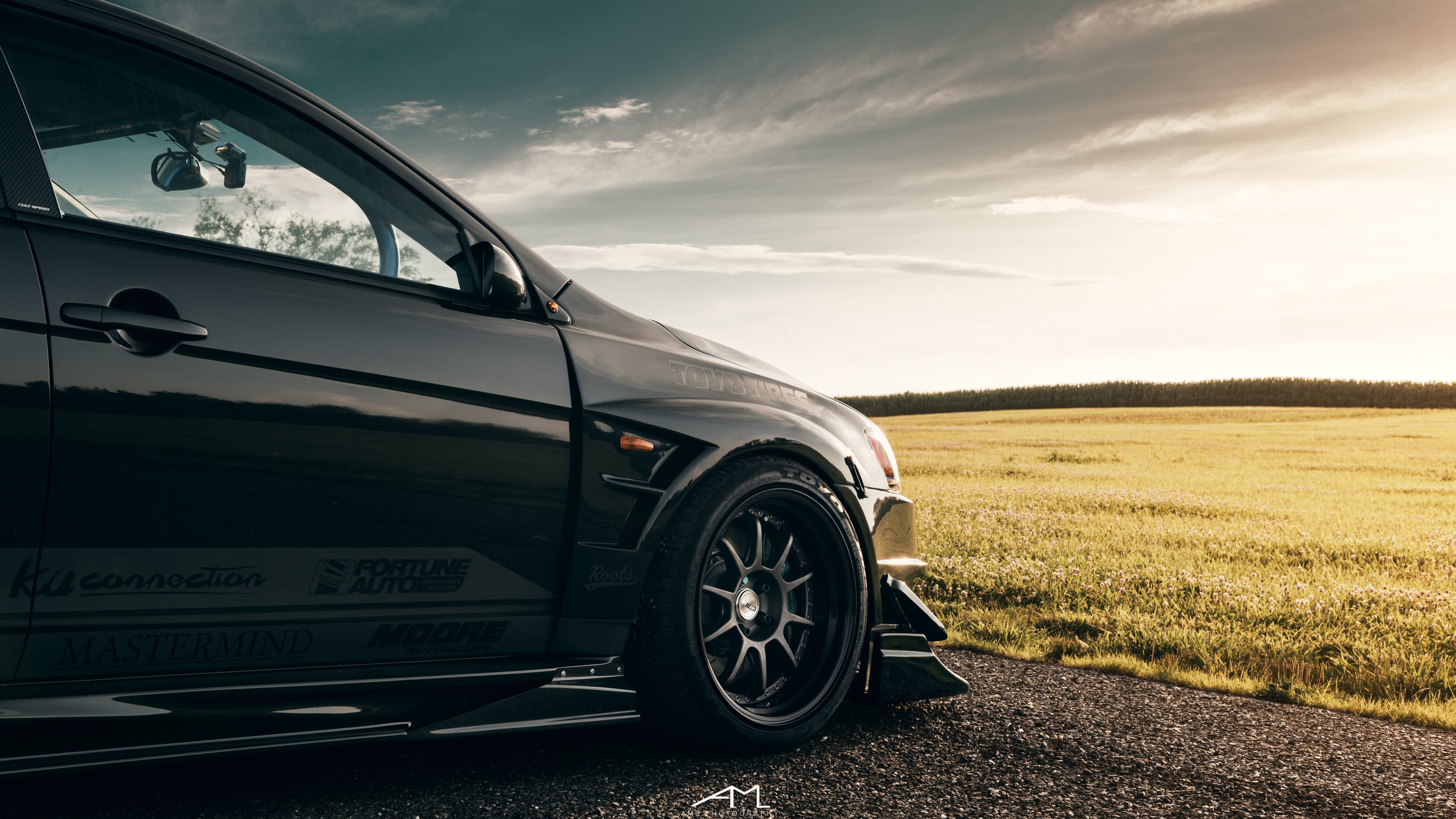 Carbon Fiber Side Skirts on Black Mitsubishi Evolution - Photo by Arlen Liverman