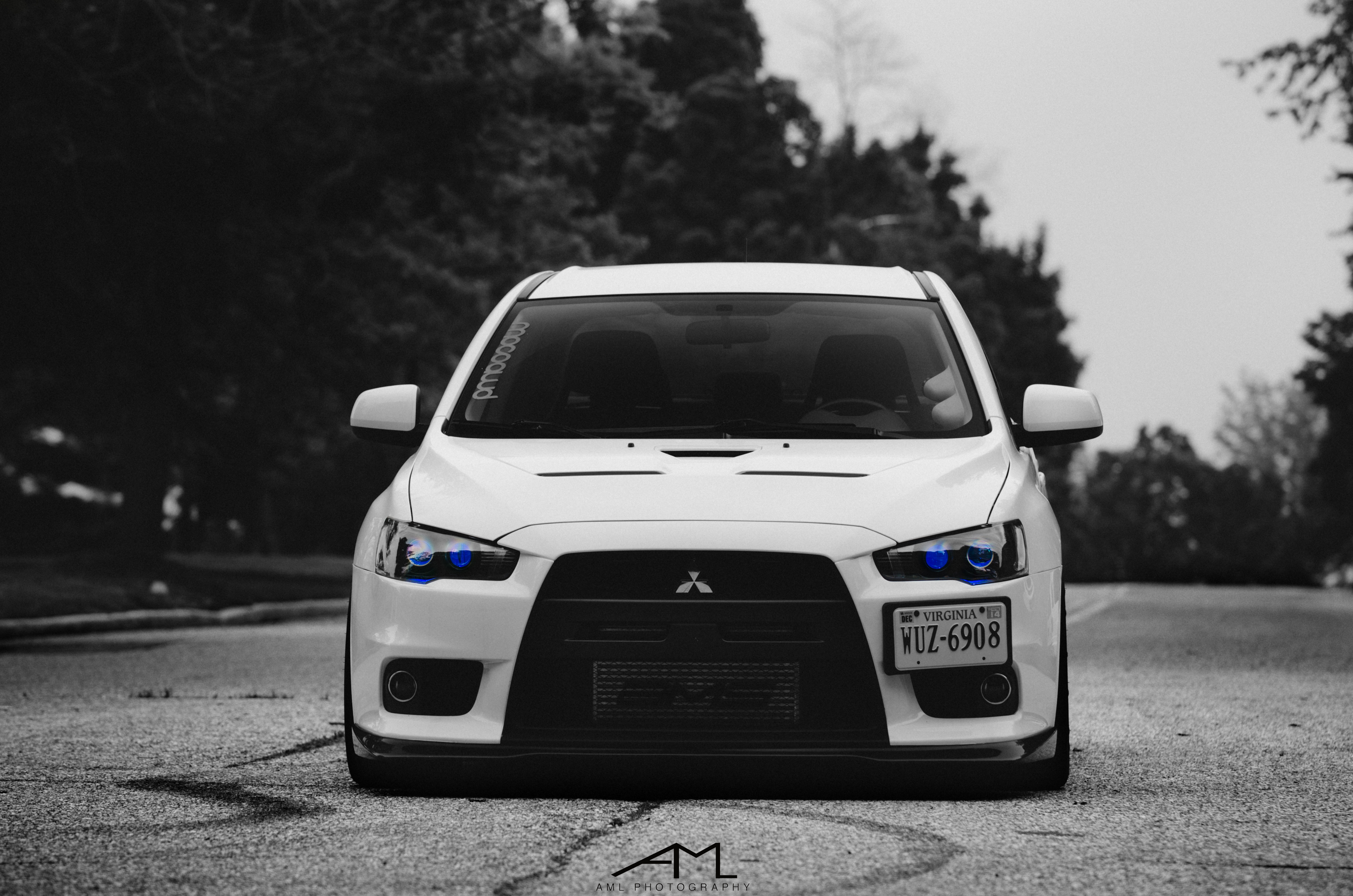 Aftermarket Vented Hood on White Mitsubishi Evolution - Photo by Arlen Liverman