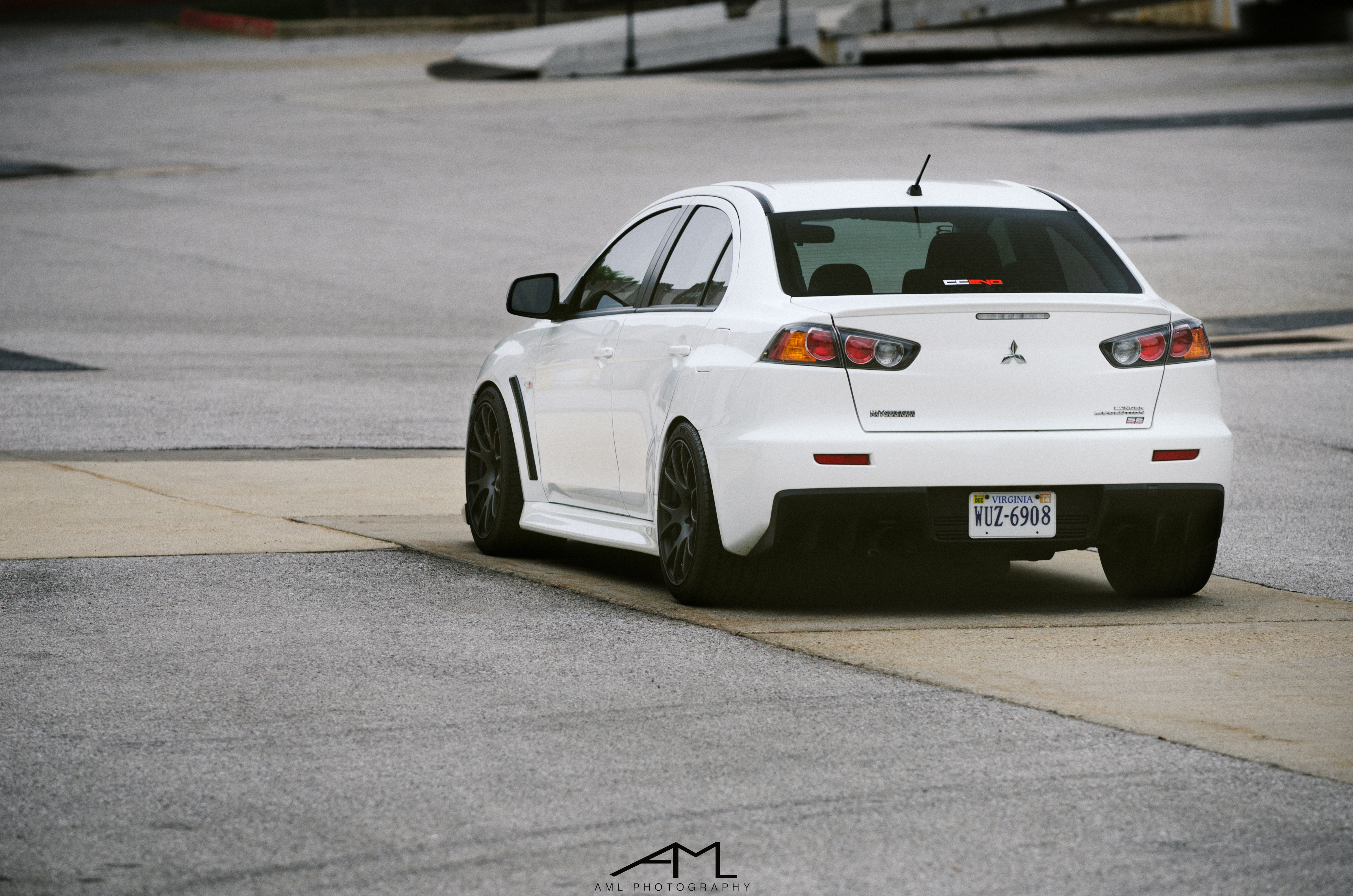 White Mitsubishi Evolution with Custom Rear Diffuser - Photo by Arlen Liverman