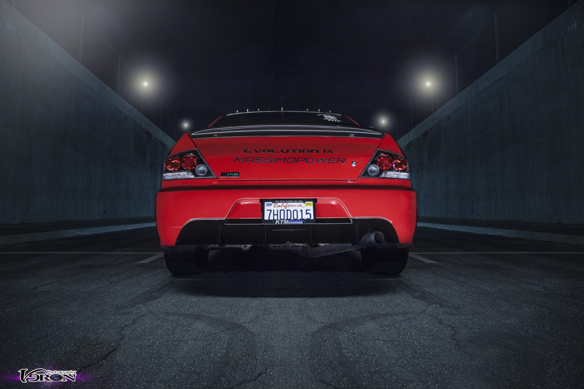 Red Mitsubishi Evolution with Custom Exhaust System - Photo by Manuel Veron