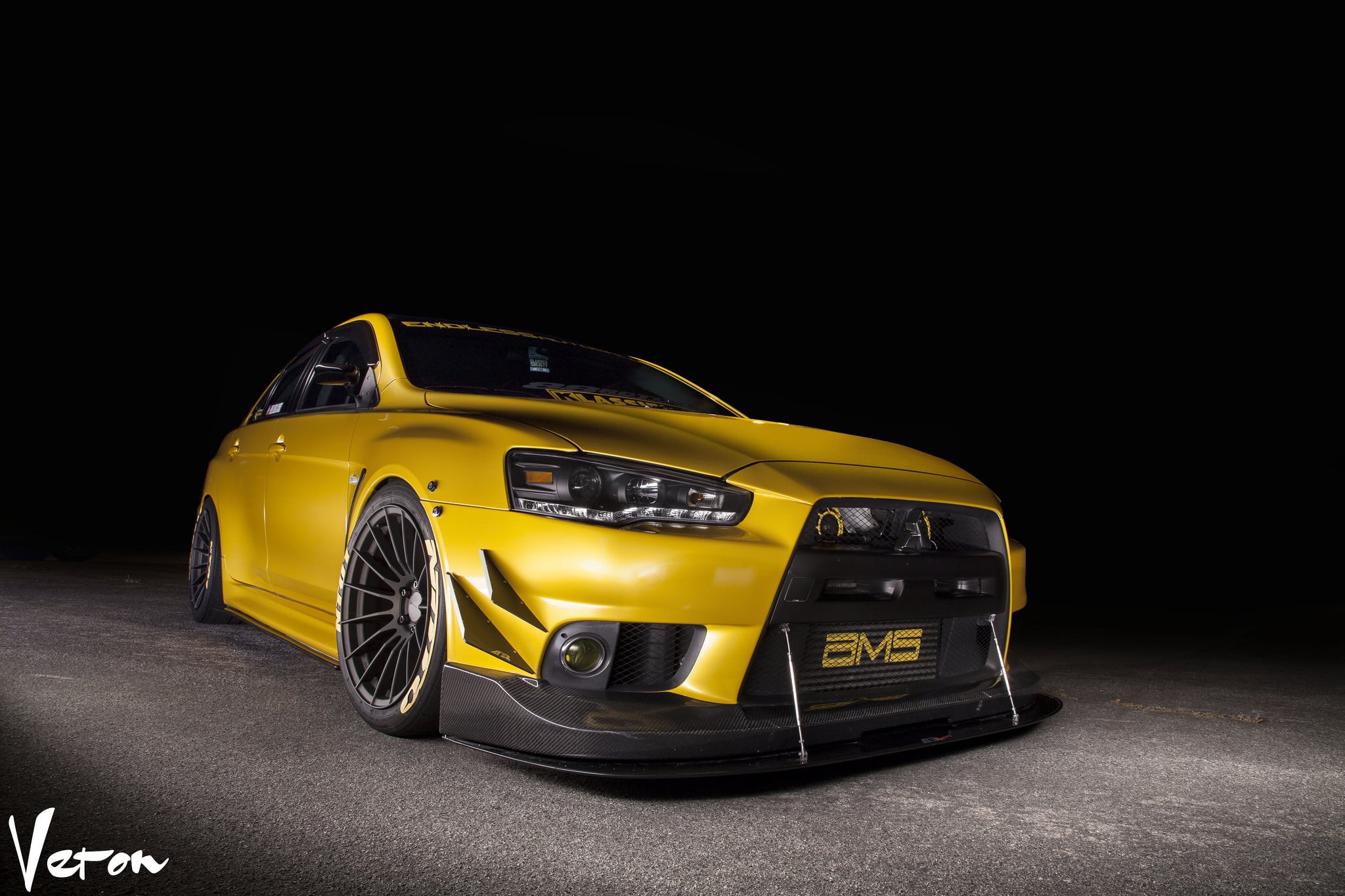 Yellow Mitsubishi Evolution with Carbon Fiber Front Lip - Photo by Manuel Veron