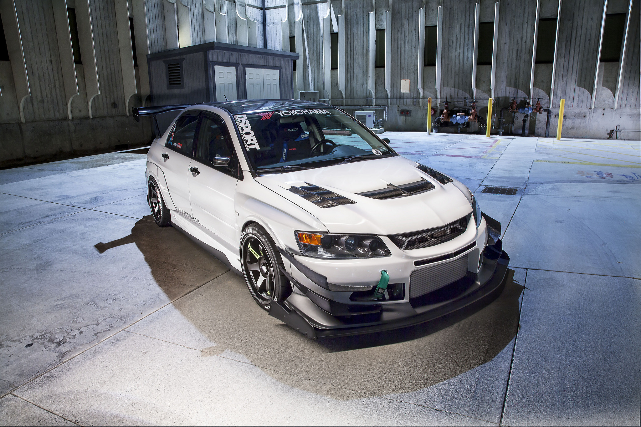 White Mitsubishi Evolution with Custom Wheels - Photo by Manuel Veron