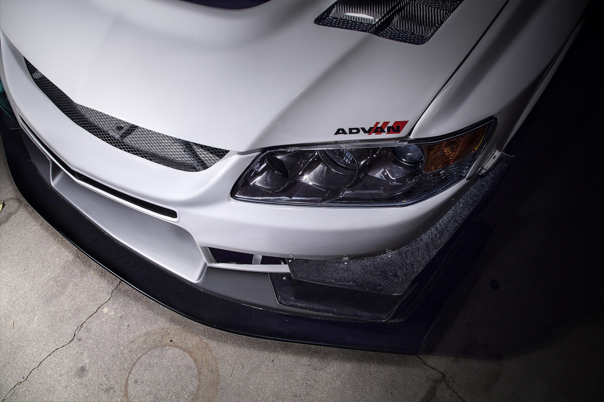 Aftermarket Front Bumper on White Mitsubishi Evolution - Photo by Manuel Veron