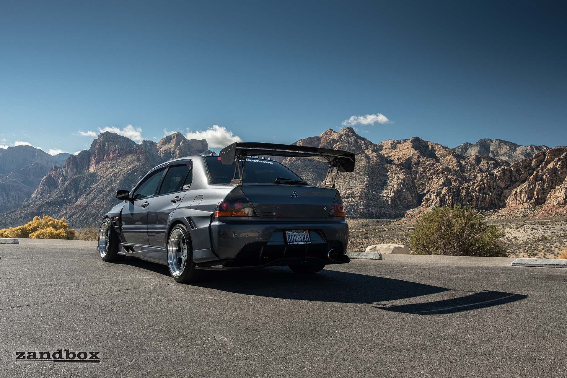 Gray Mitsubishi Evolution with Custom Large Wing Spoiler - Photo by zandbox