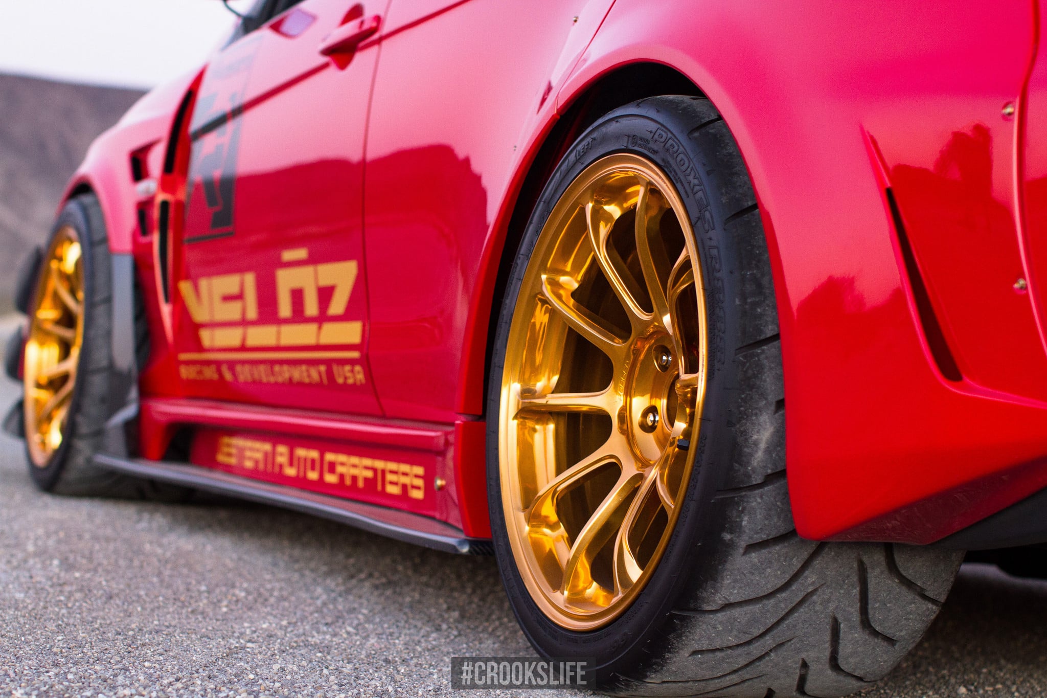 Red Mitsubishi Lancer Evolution with Forged Gold Rims - Photo by Jimmy Crook