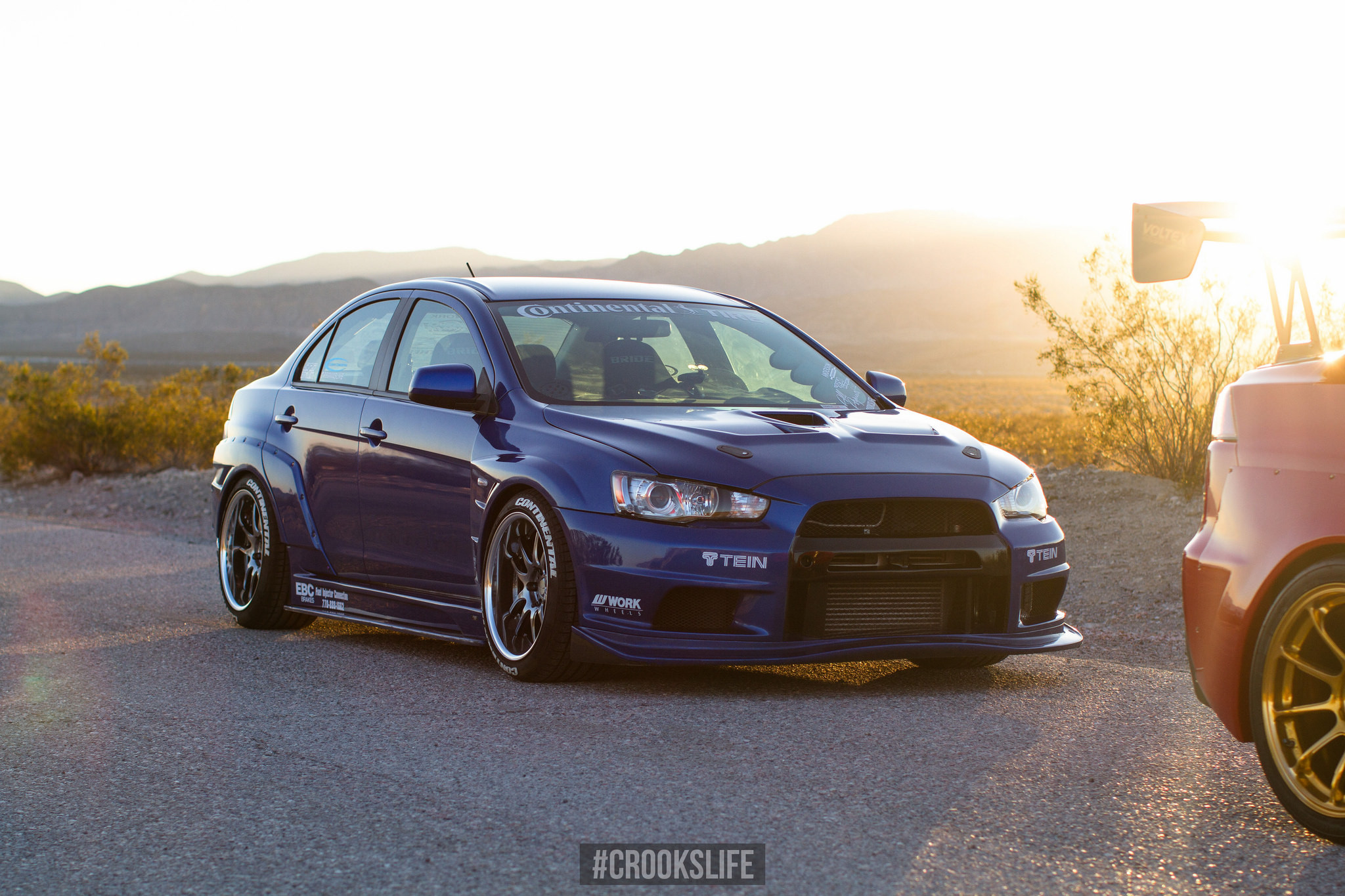 Blue Mitsubishi Lancer Evolution on Custom Work Wheels - Photo by Jimmy Crook