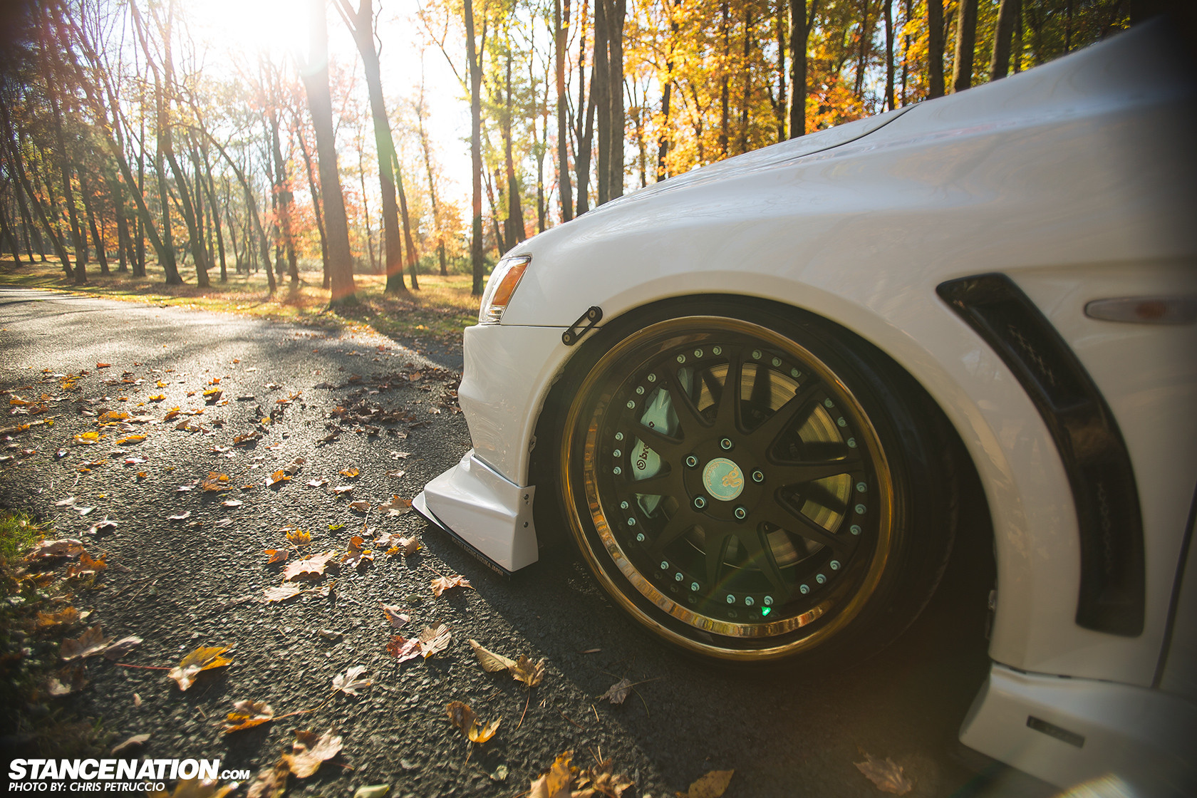 Aftermarket Front Bumper on White Mitsubishi Evolution - Photo by Avant Garde Wheels