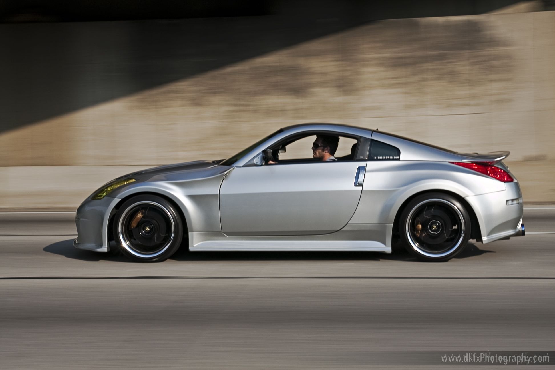 Stylish Cheetah: Gray Nissan 3350Z with Yellow Headlights