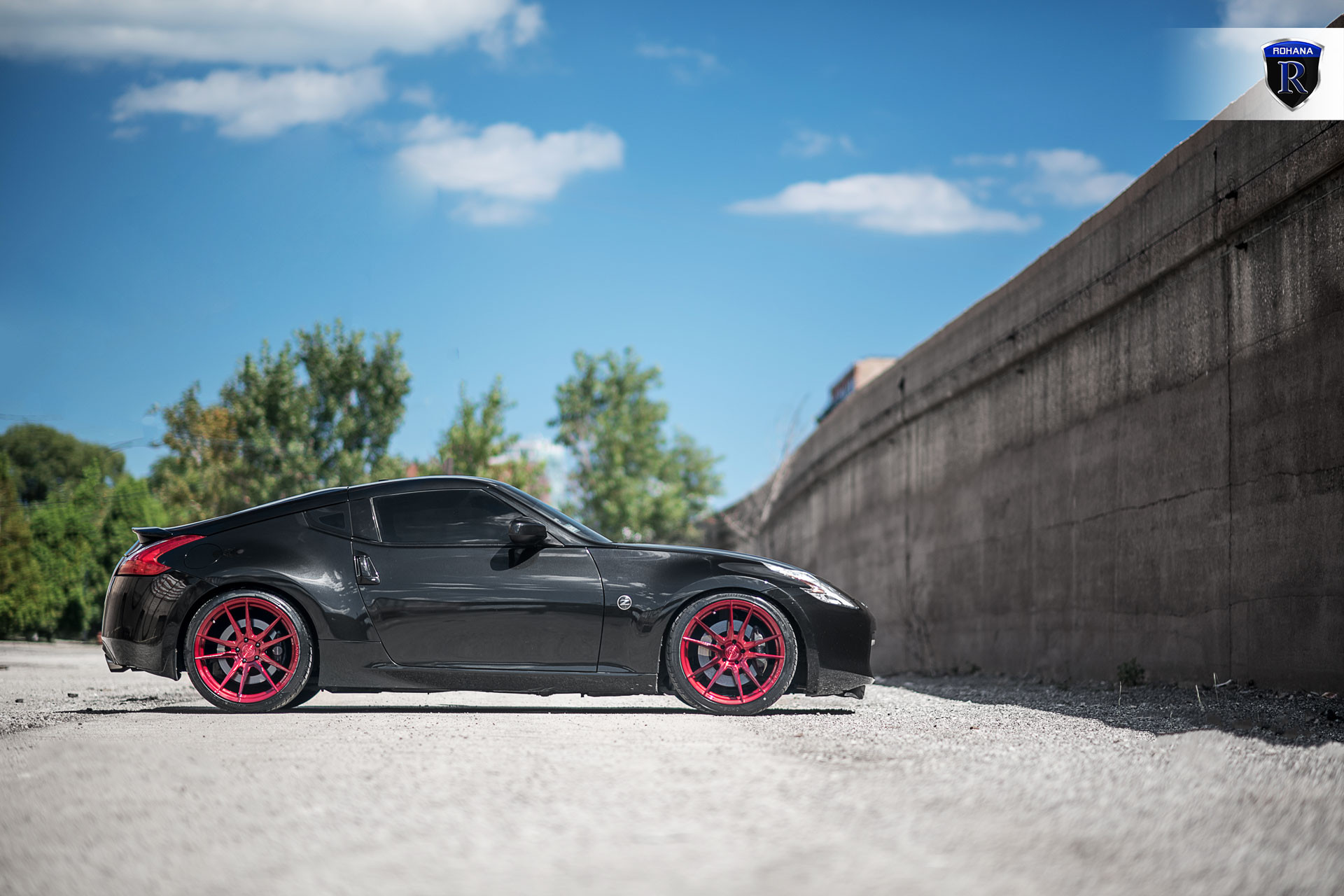Black Nissan 370z With Red Rims - Photo by Rohana Wheels