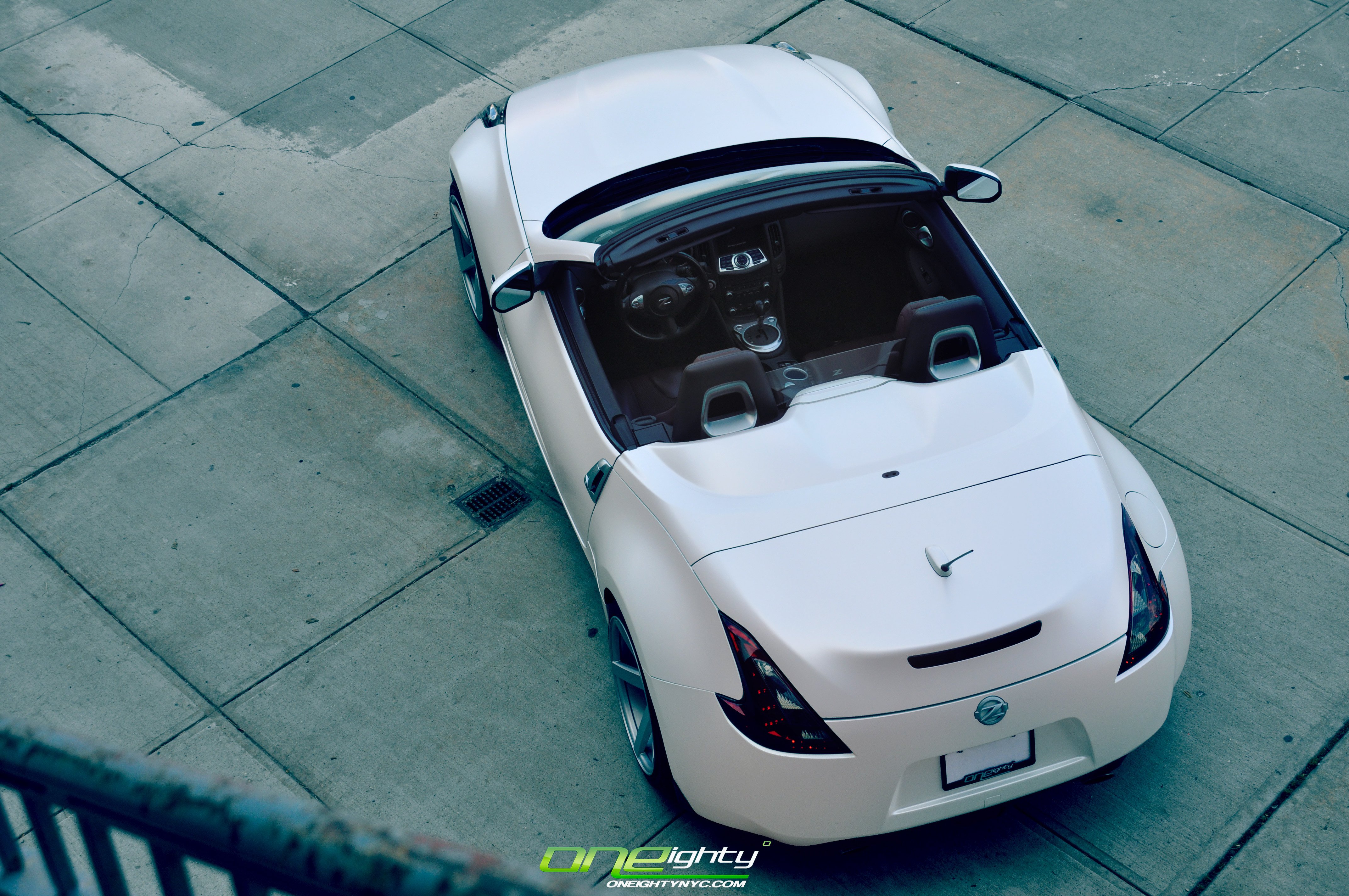 Red Smoke Taillights on White Convertible Nissan 370Z - Photo by ONEighty NYC