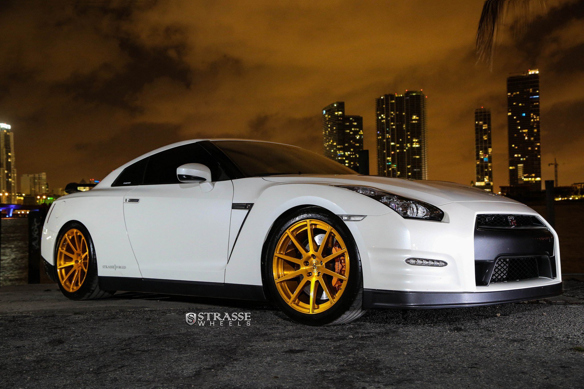 Eye-catching Aftermarket Gold Strasse Wheels Adorning White