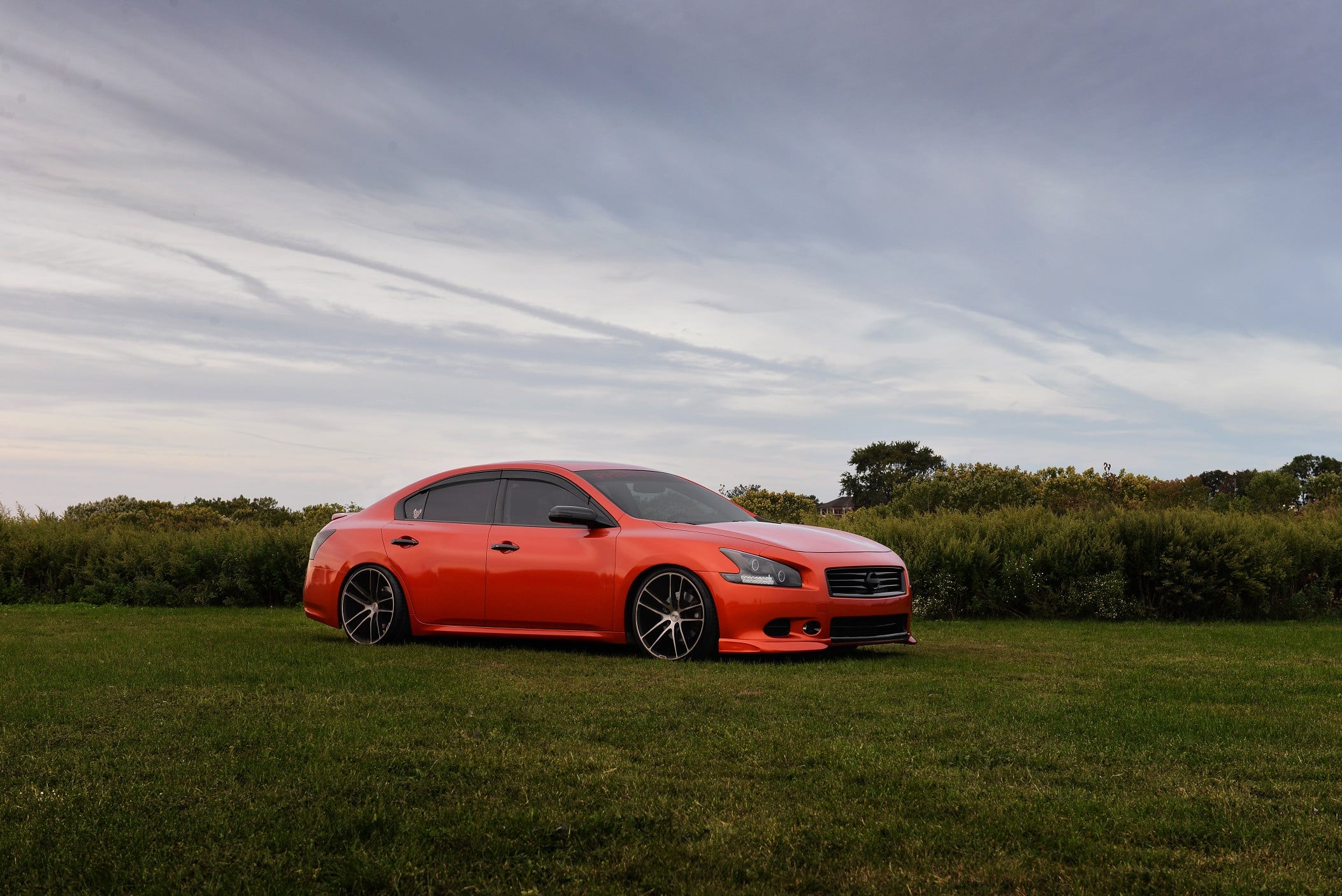 Dark Smoke LED Taillights on Red Nissan Maxima - Photo by Niche