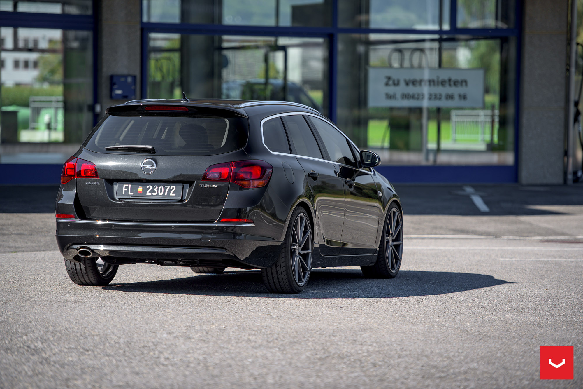 Black Opel Astra Turbo with Roofline Spoiler - Photo by Vossen