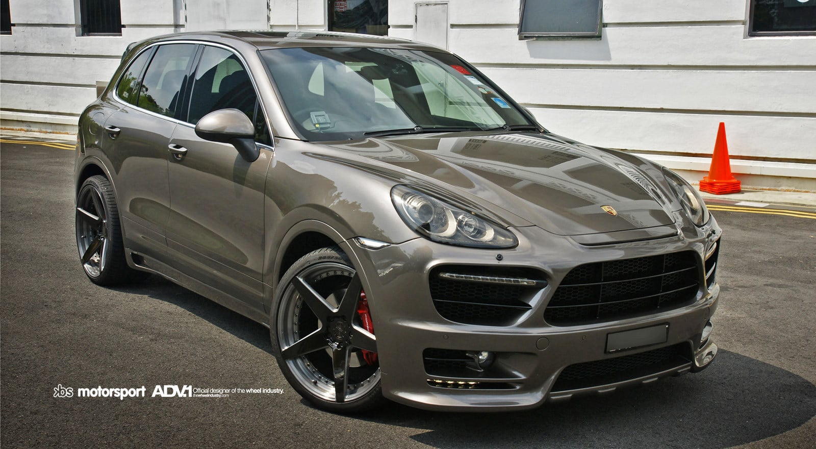 Gray Porsche Cayenne with Aftermarket Headlights - Photo by ADV.1