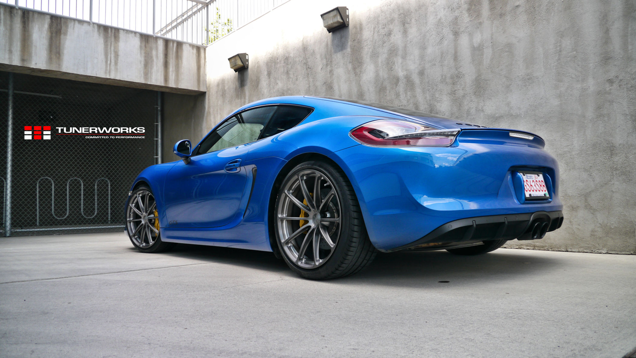 Gunmetal Forgeline Rims on Blue Porsche Cayman GTS - Photo by Forgeline Motorsports