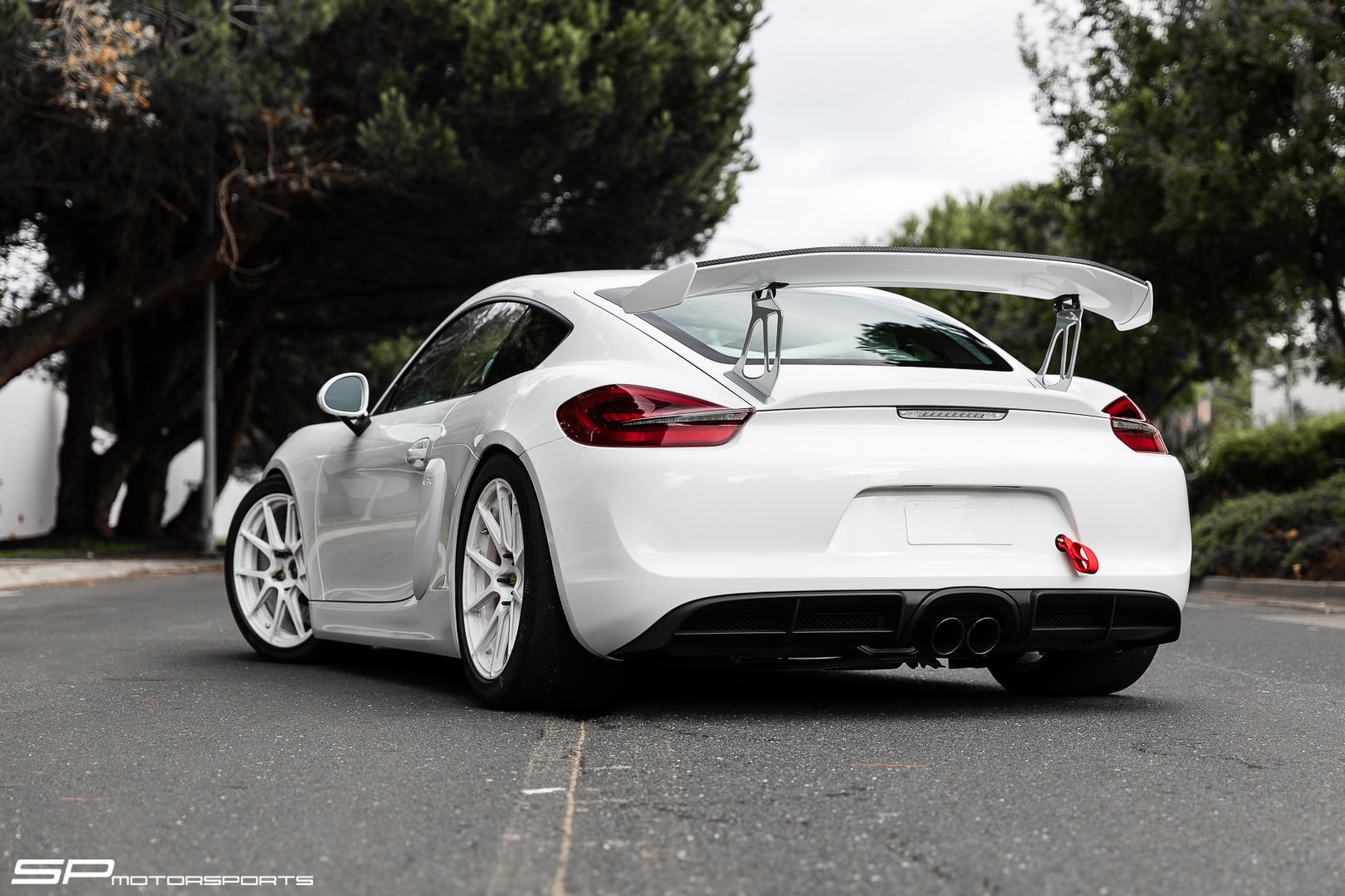 White Porsche Cayman with Large Wing Spoiler - Photo by Forgeline Motorsports