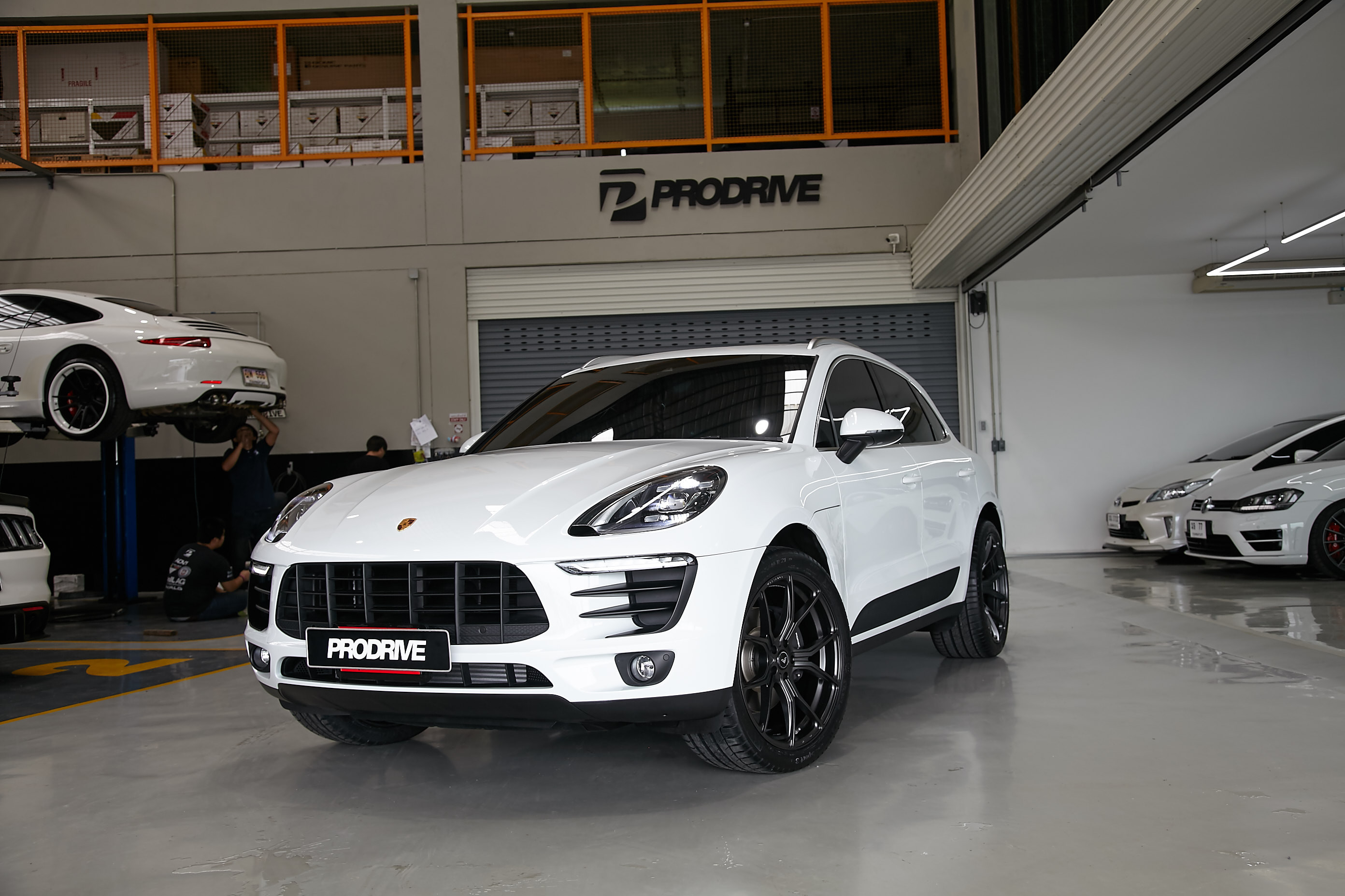 Front Bumper with Fog Lights on White Porsche Macan - Photo by Vorstiner