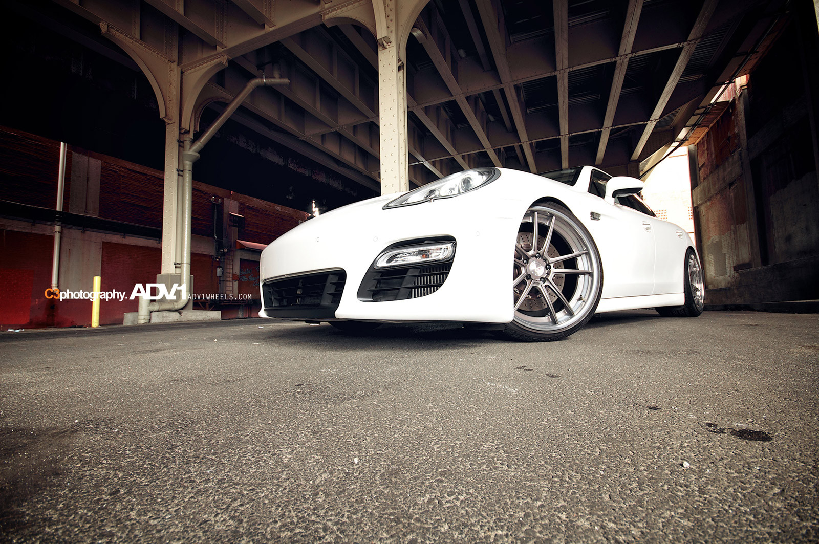 White Porsche Panamera with Aftermarket Headlights - Photo by ADV.1