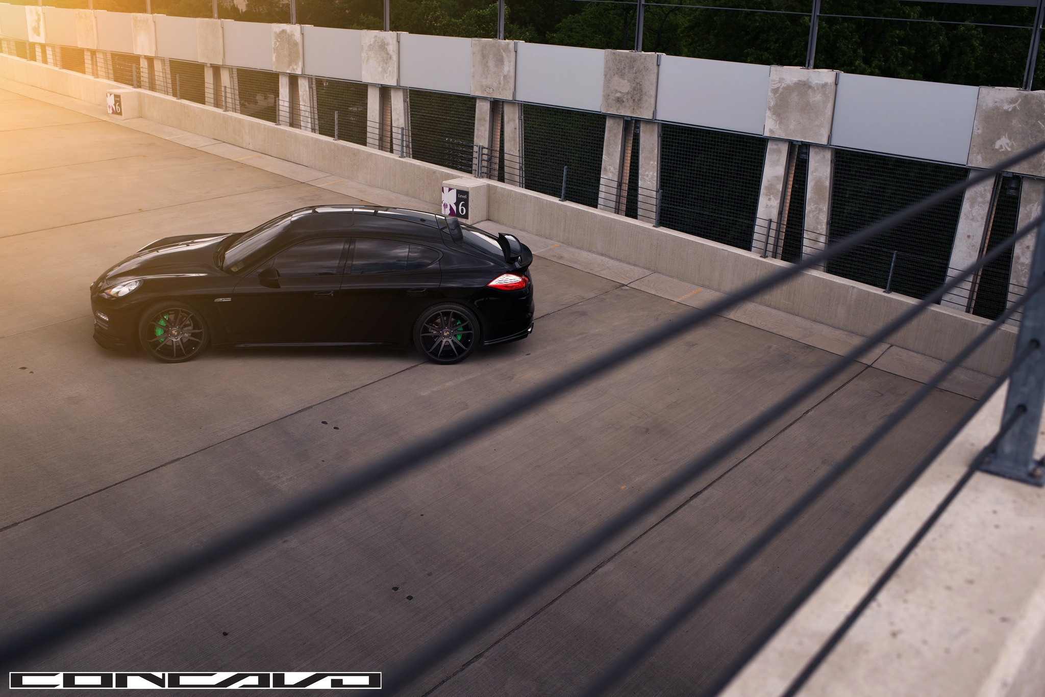 Black Porsche Panamera with Aftermarket Rear Spoiler - Photo by Concavo Wheels