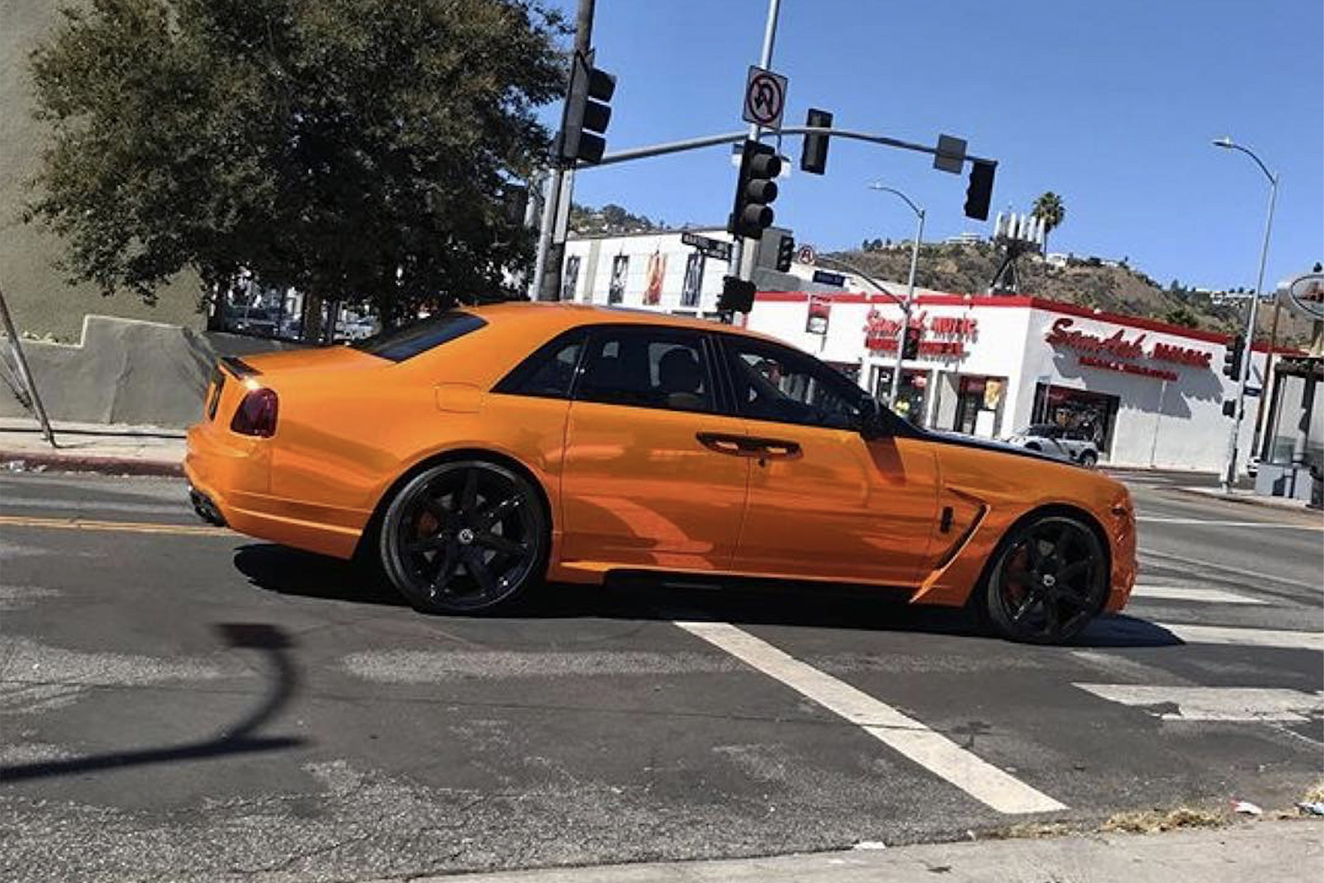 Aftermarket Side Skirts on Orange Rolls Royce Ghost - Photo by Forgiato