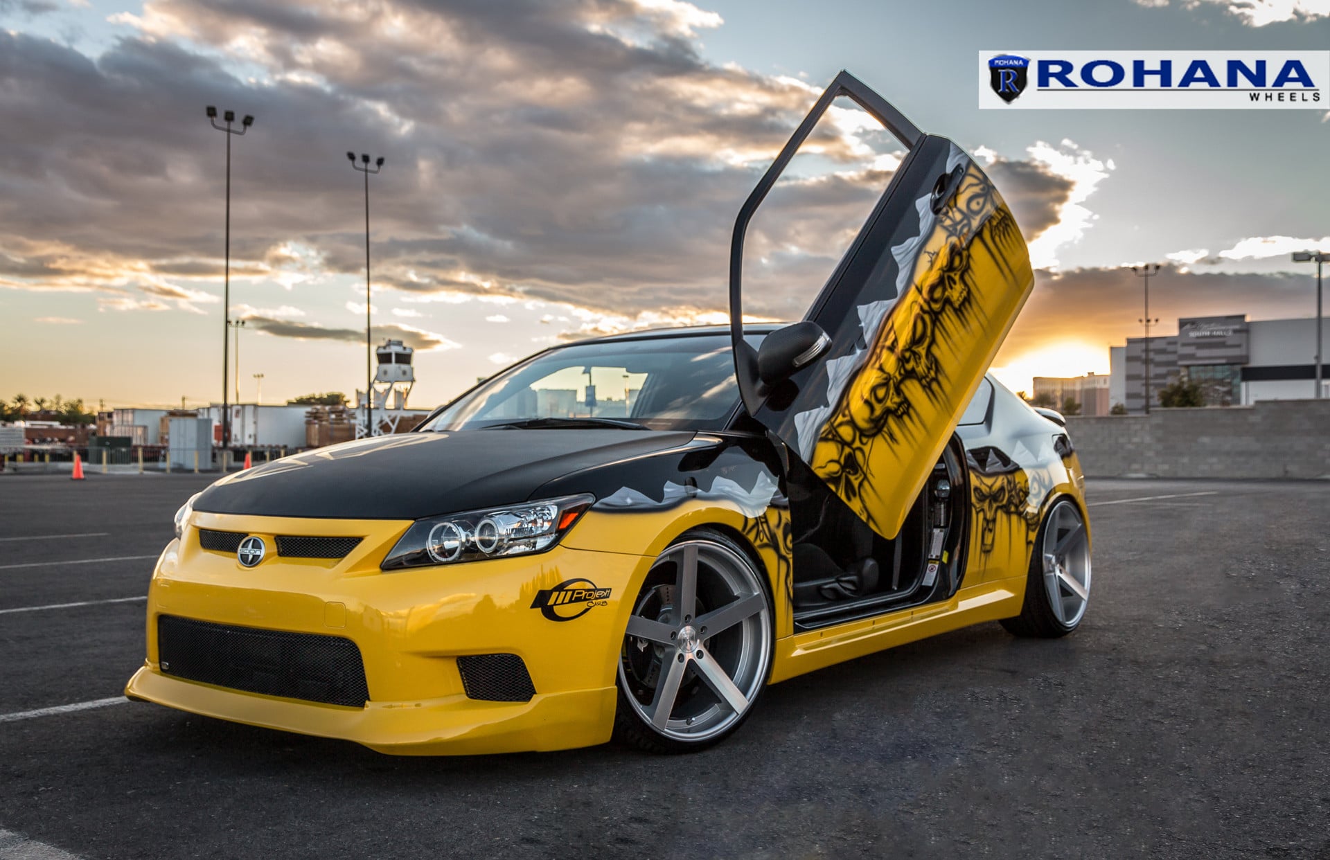 Yellow Scion TC with Custom Graphics and Lambo Doors - Photo by Rohana Wheels