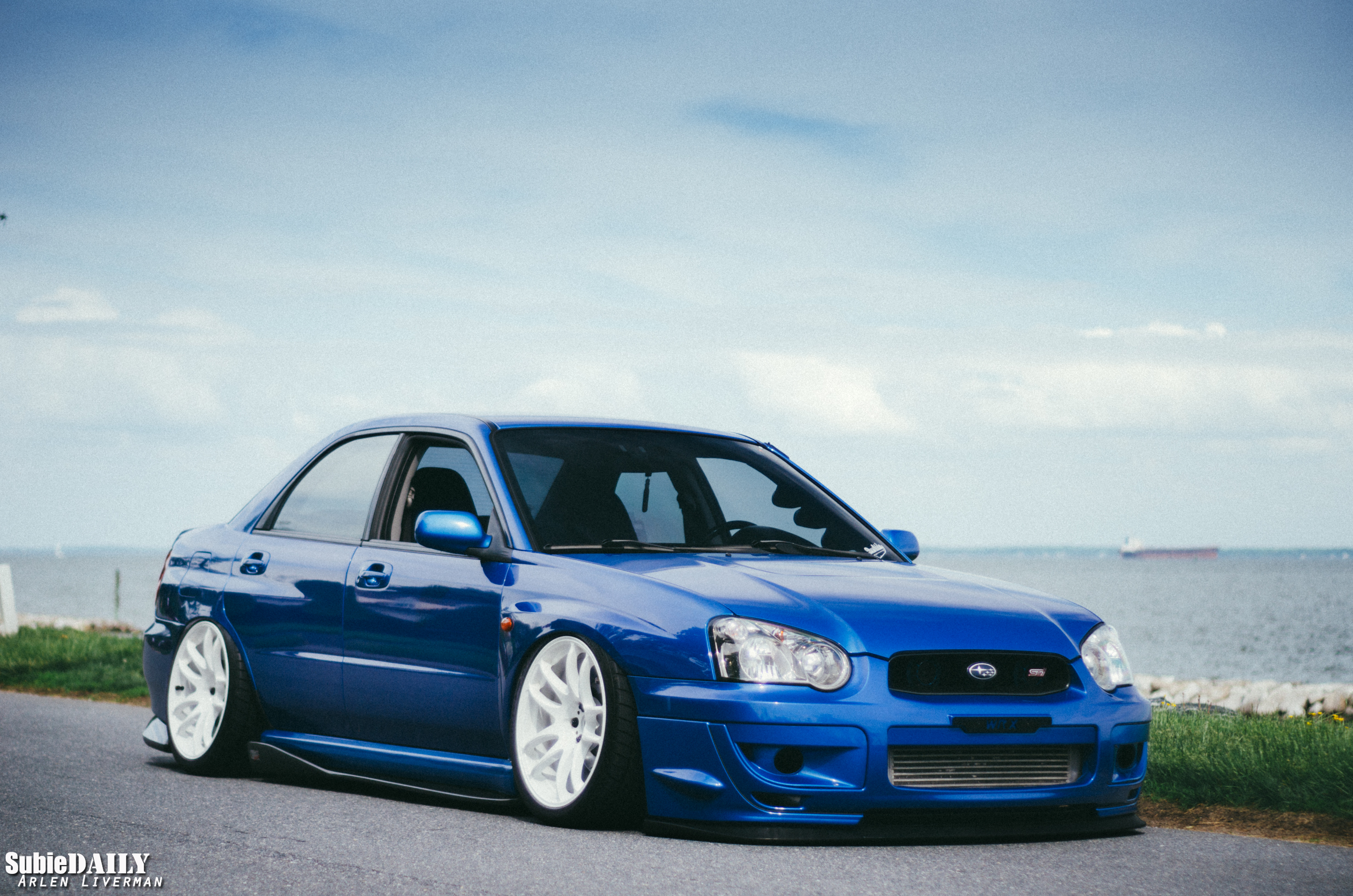 Custom Front Bumper on Blue Stanced Subaru WRX - Photo by Arlen Liverman