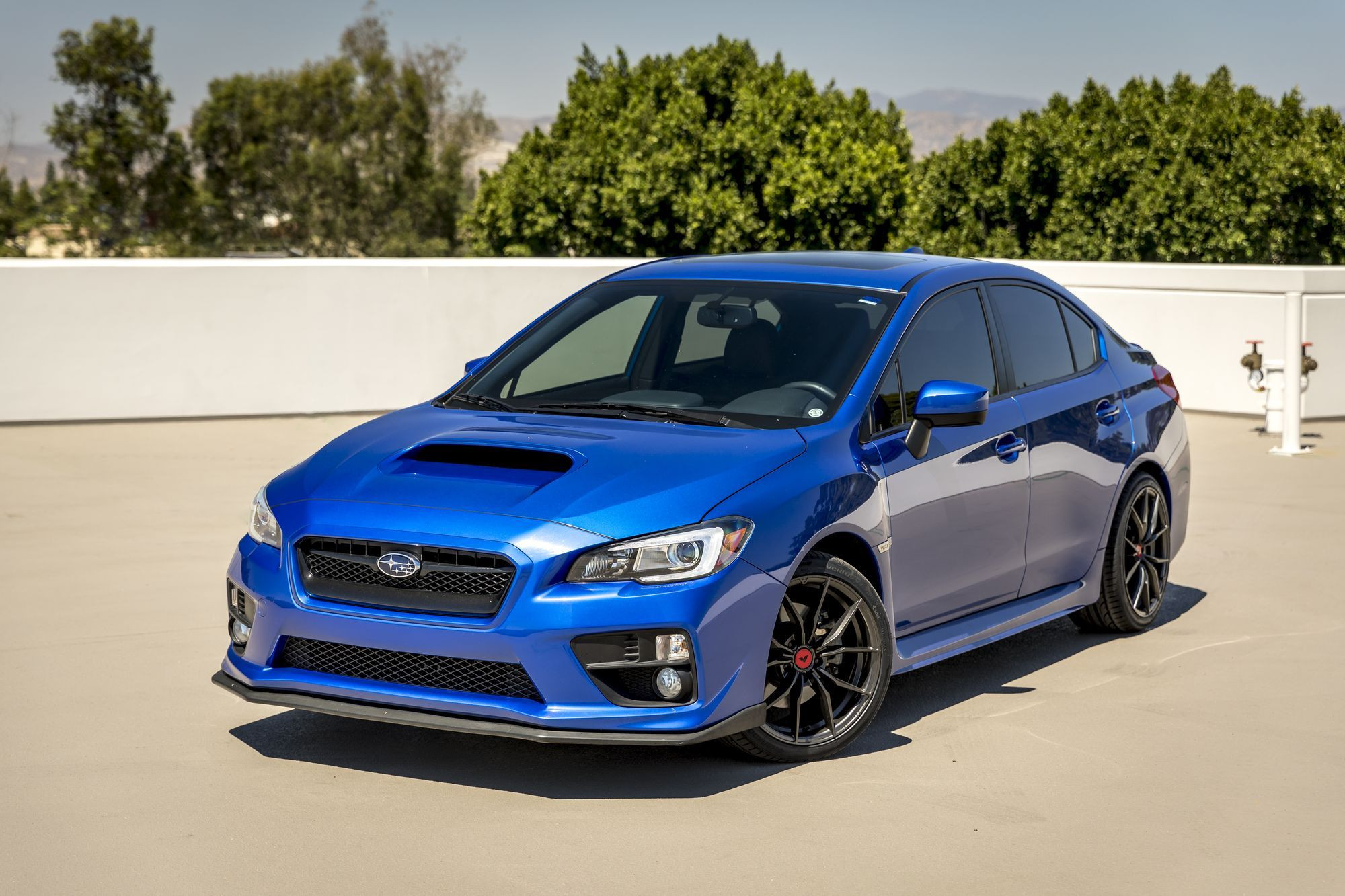 Aftermarket Front Lip on Blue Subaru WRX - Photo by Vorstiner